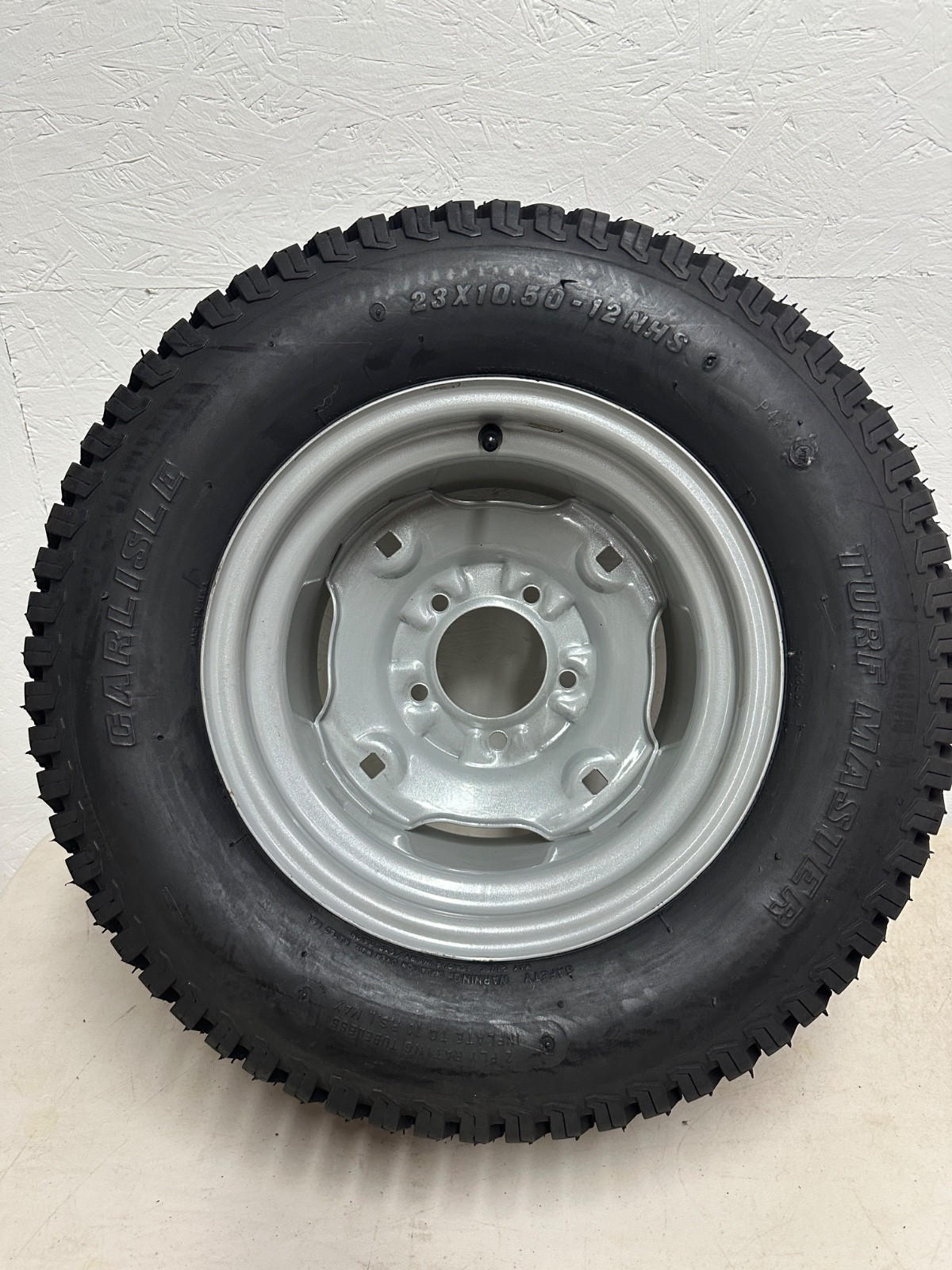 Carlisle Wheel & Tire Assembly 23 x 10.50 - 12 NHS 5 Lug Turf Thread Offset Hub