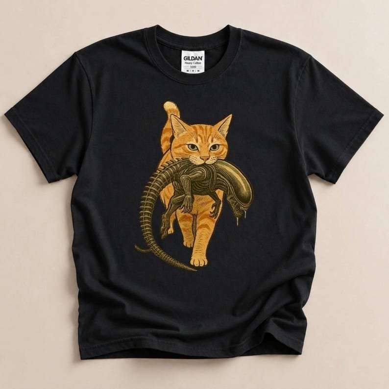 Cat Carrying Alien T-Shirt, Funny Sci-Fi Cat Shirt, Orange Tabby Cat Tee, Xenomo