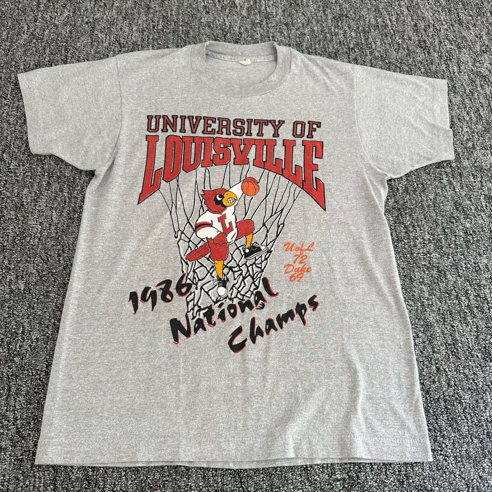 Vintage 1986 University of Louisville Cardinals National Champs T-Shirt Vintage 1986 University of Louisville Cardinals National Champs T-Shirt
