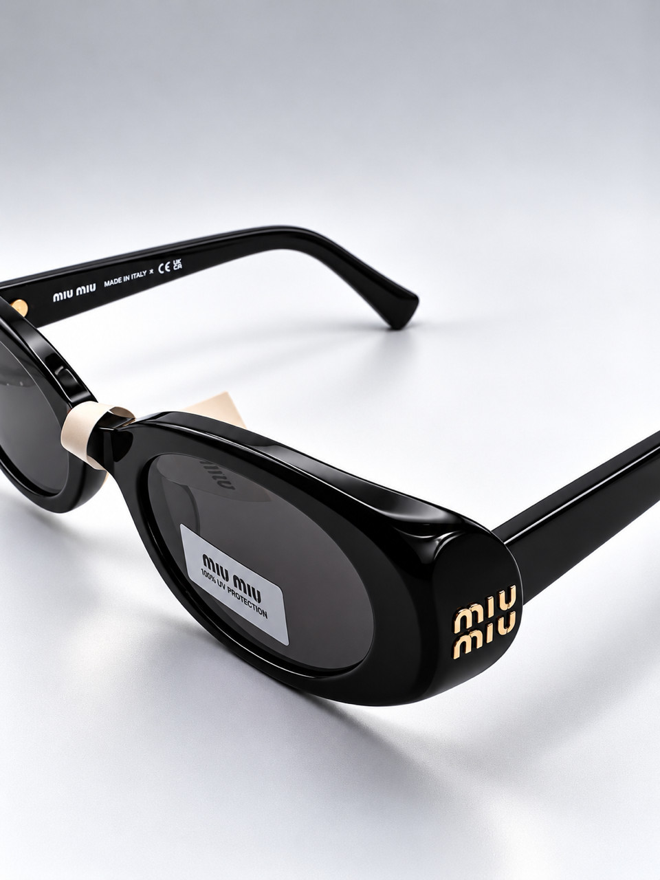 Miu Miu MU B09S 16K08Z Oval Sunglasses in Black /Gray Lens 100% UV