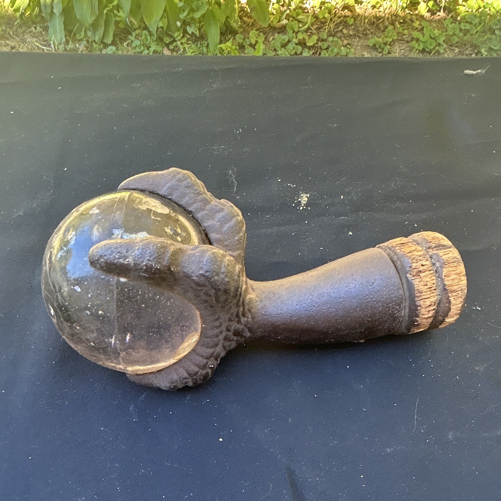 Antique 1900s Cast Iron Hand Doorstop w/ Clear Glass Ball Brown Rusted
