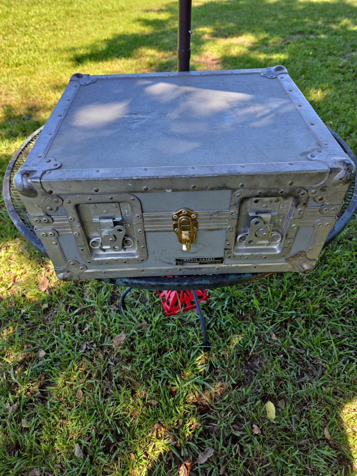 Vintage Anvil Case ,metal edging, butterfly latches, and a central padlock loop.