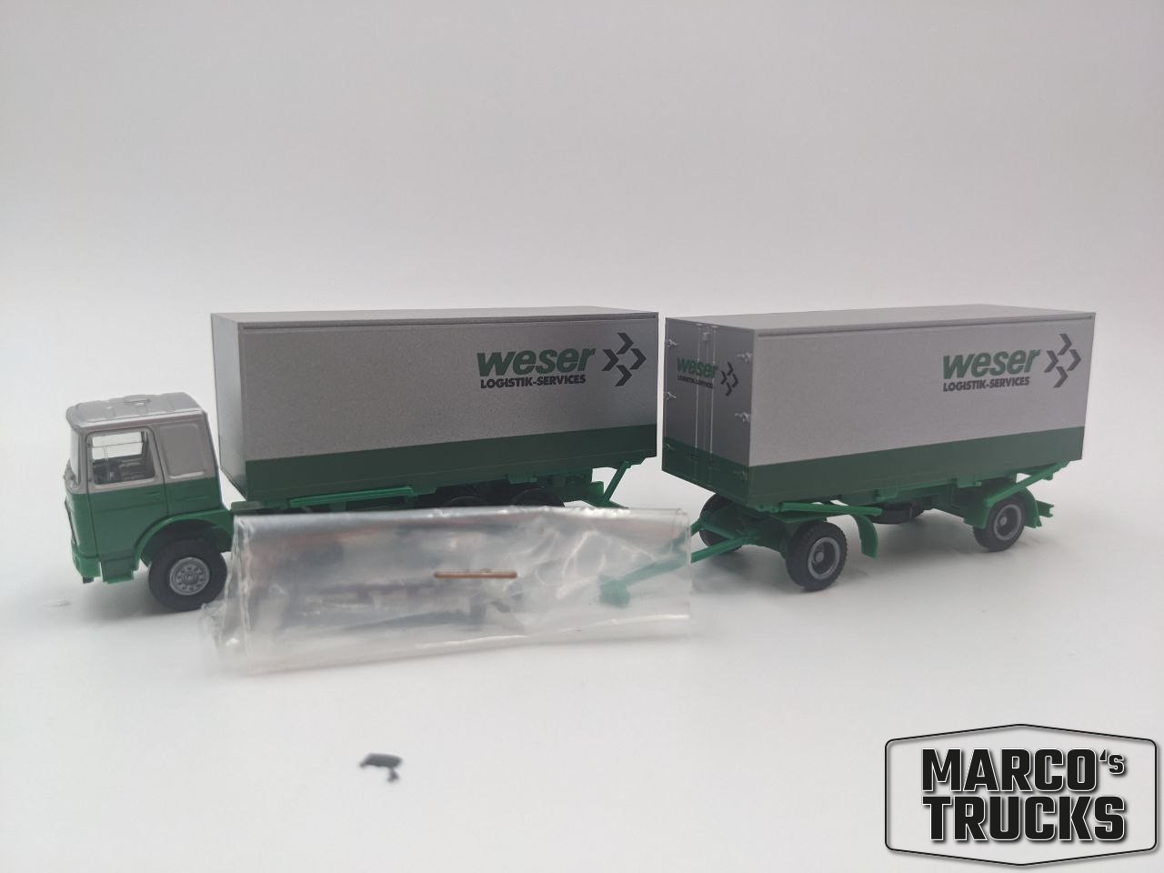 Herpa MAN F8 refrigerated trailer green/silver „Weser Logistk-Services“ 1:87 /HU