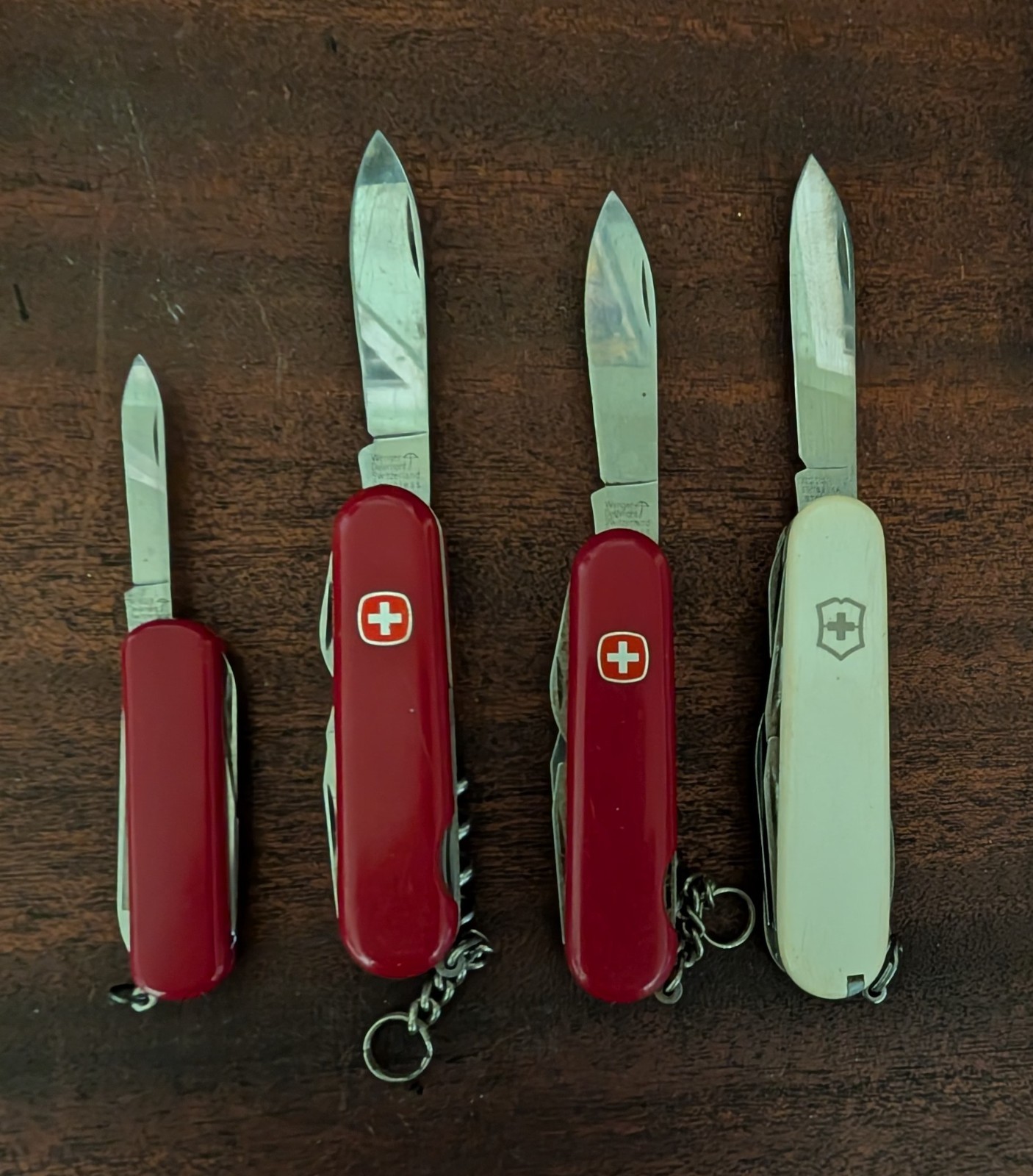 3 Vintage Wenger Delemont Swiss Army Knife and one victorinox white used 3 Vintage Wenger Delemont Swiss Army Knife and one victorinox white used