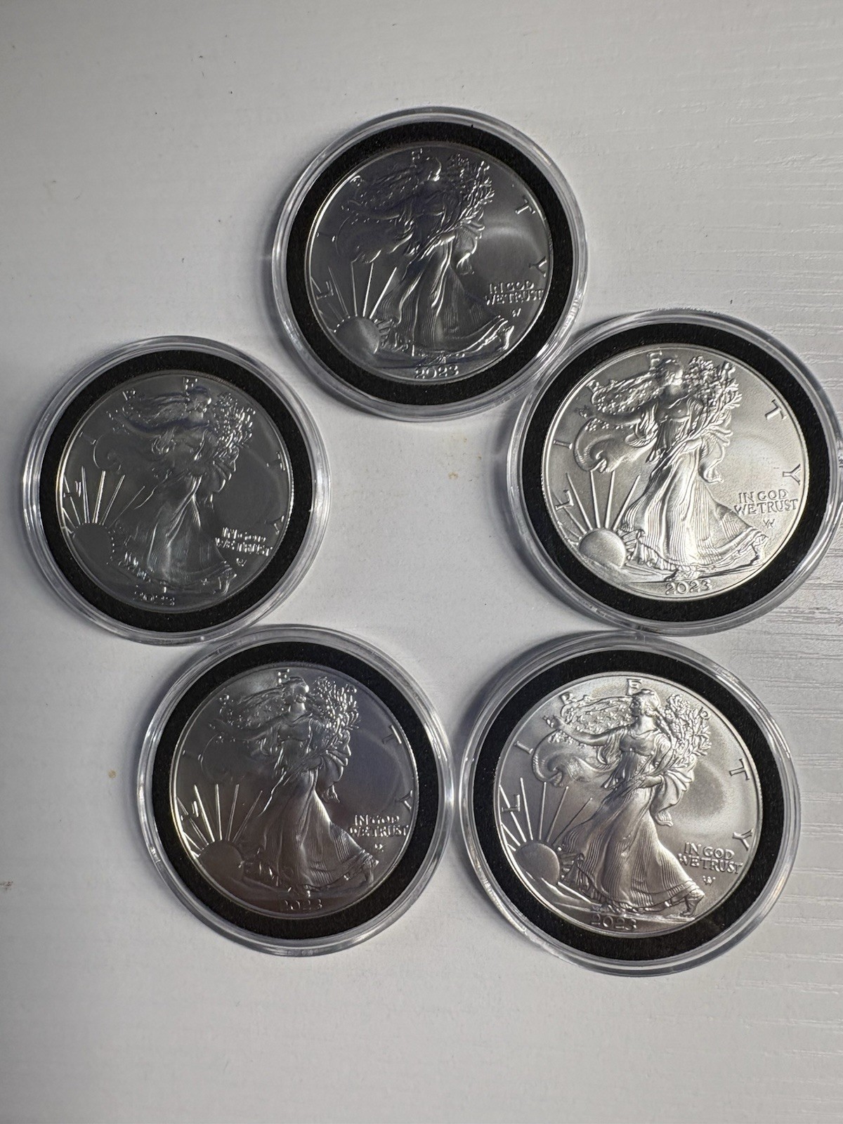 Five 2023 (W) Silver Eagles. Photos of diameter and weight provided.