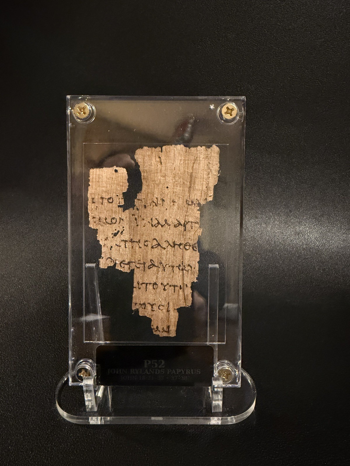 P52 John Rylands Papyrus.   Gospel of John. Biblical manuscript. Hand Distressed
