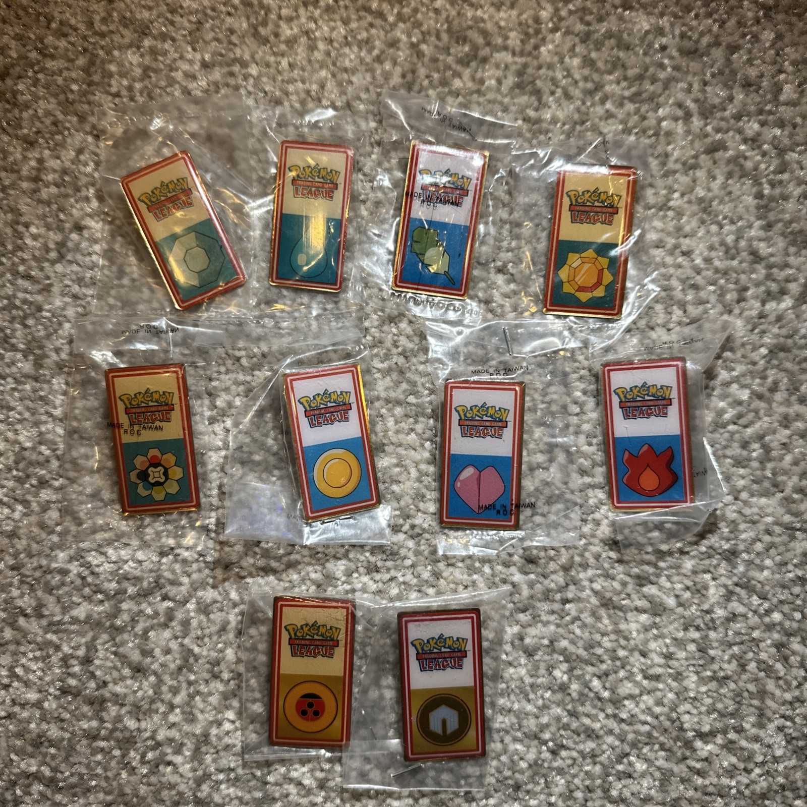 Pokémon League Kanto Gym Badge Pins 2000 WOTC Lot Of 10 Complete Sealed RARE Pokémon League Kanto Gym Badge Pins 2000 WOTC Lot Of 10 Complete Sealed RARE