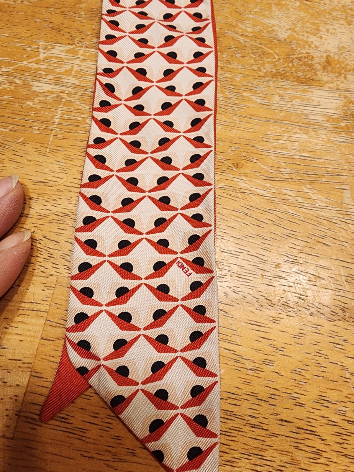 Fendi 100% silk monster twilly scarf featuring a red, white, and black geometric