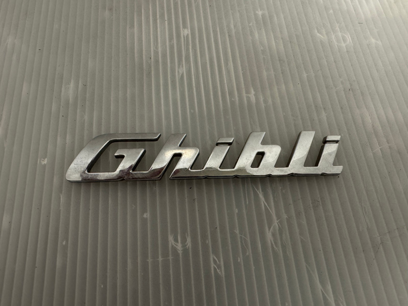2014-2017 Maserati Ghibli Trunk Lid Emblem Badge Glossy Chrome 670008315 OEM A1 2014-2017 Maserati Ghibli Trunk Lid Emblem Badge Glossy Chrome 670008315 OEM A1