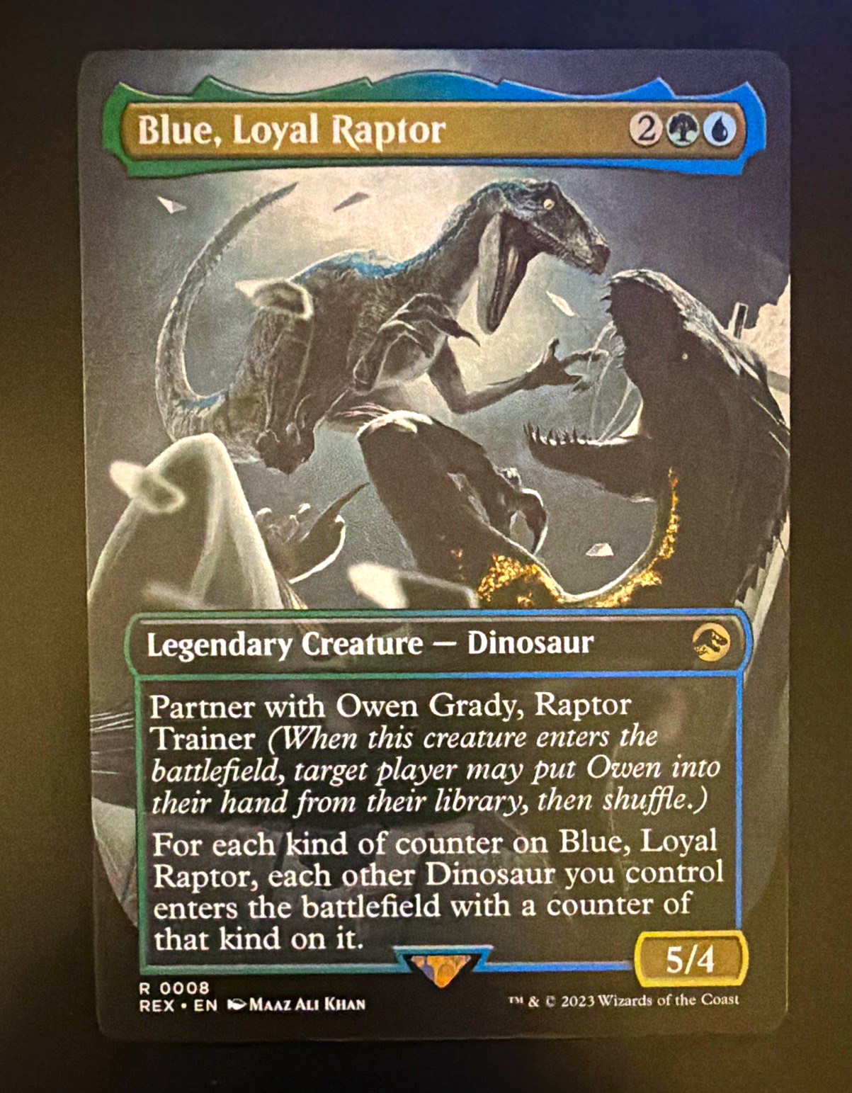 Blue, Loyal Raptor #008 (Borderless) - Universes Beyond: Jurassic World MTG
