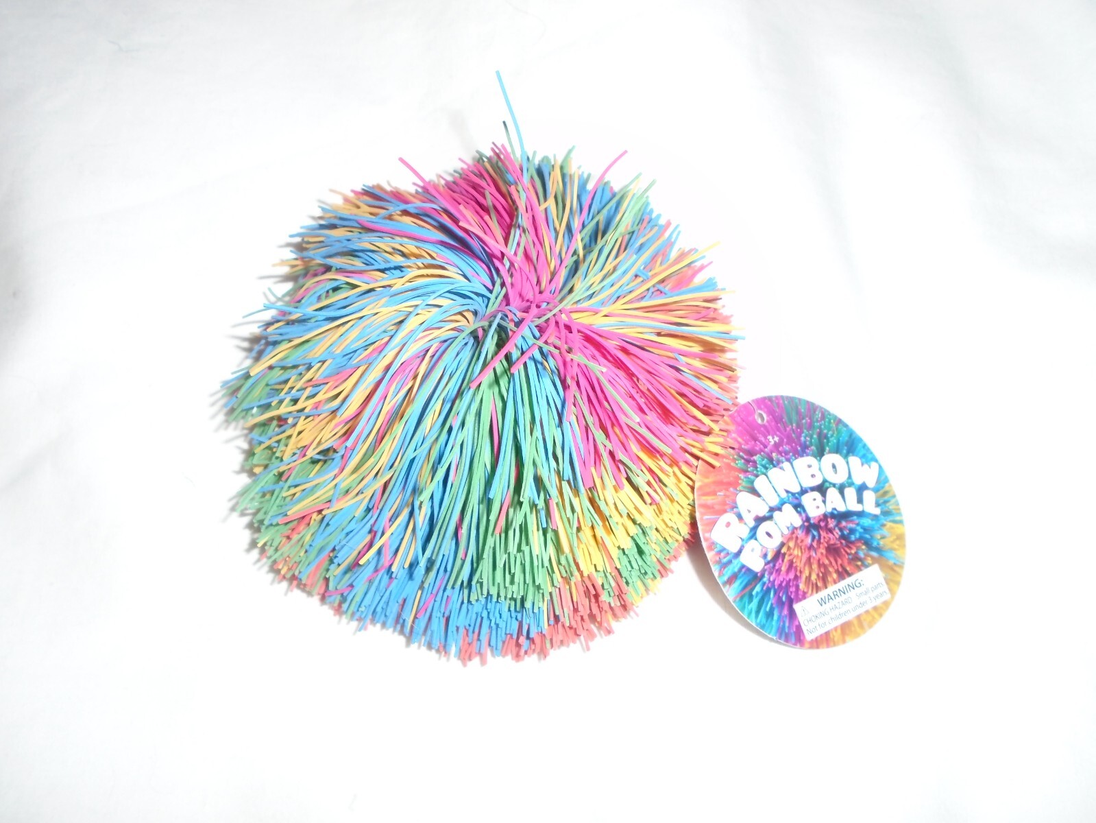 Toysmith Rainbow Pom Ball - NEW. Toysmith Rainbow Pom Ball - NEW.