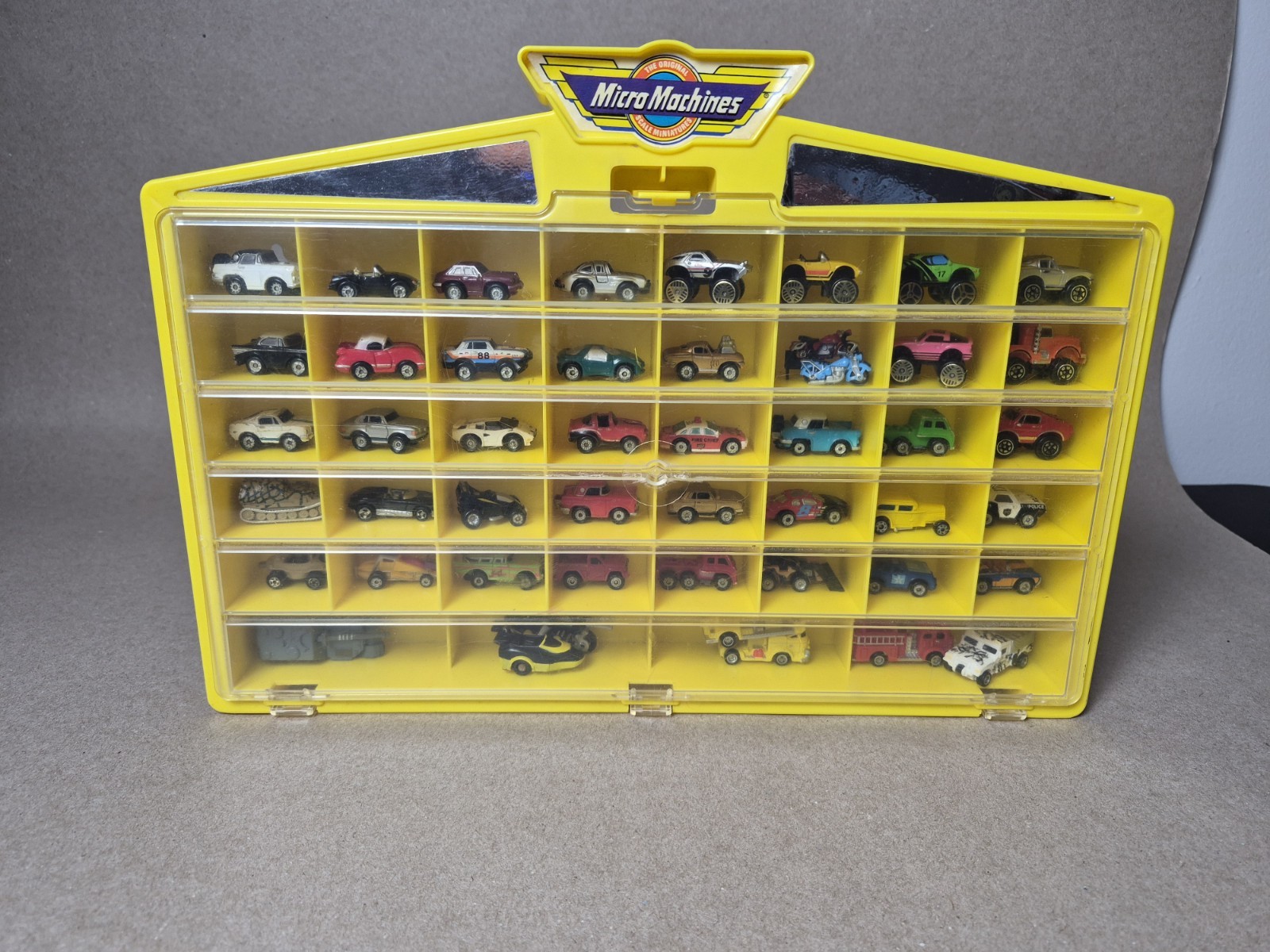 Vintage Micro Machines Yellow Display/Storage Case with 40 vehicles A3 Vintage Micro Machines Yellow Display/Storage Case with 40 vehicles A3