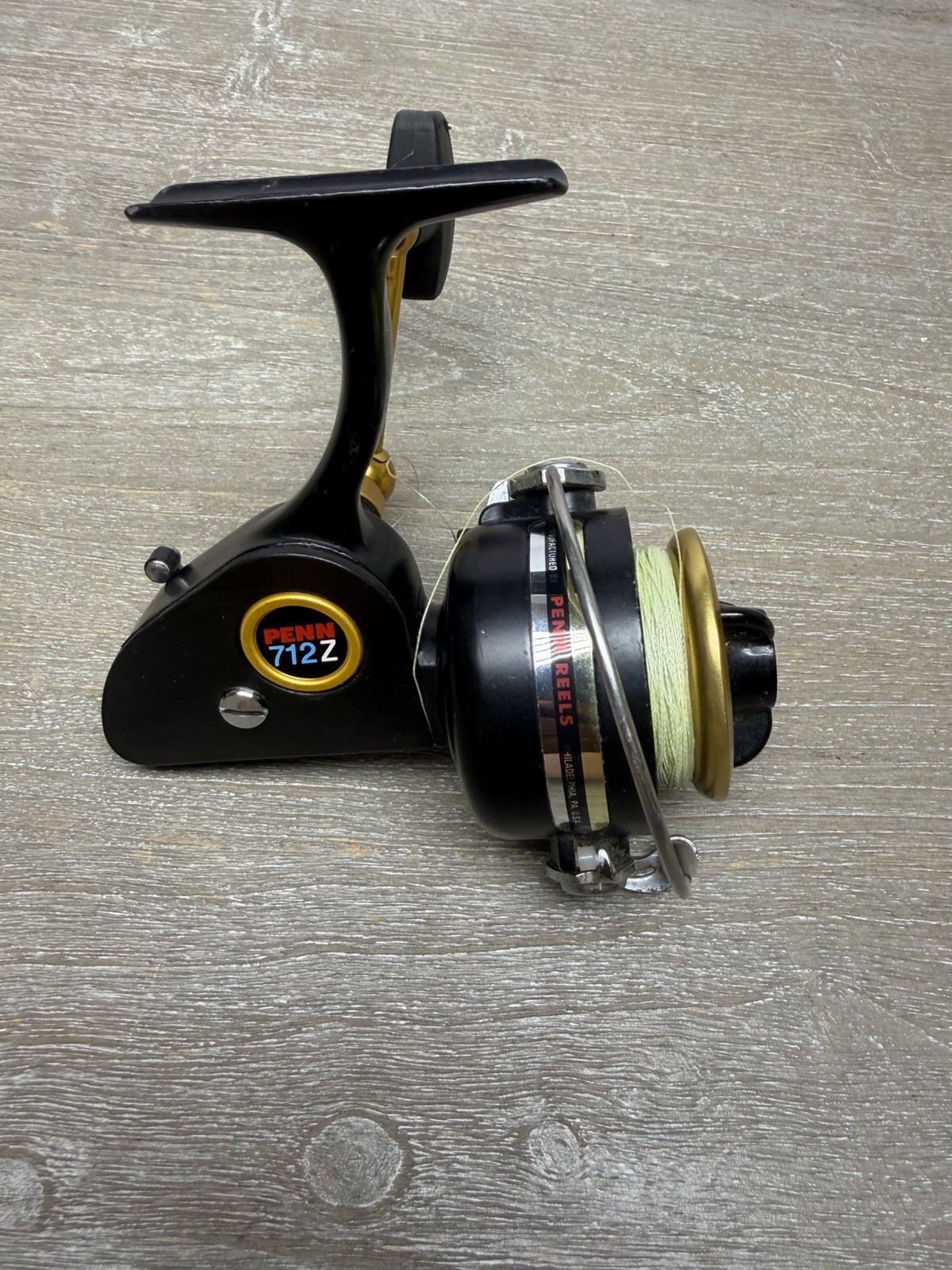Vintage Penn 712Z Black Gold Spinning Fishing Reel USA 