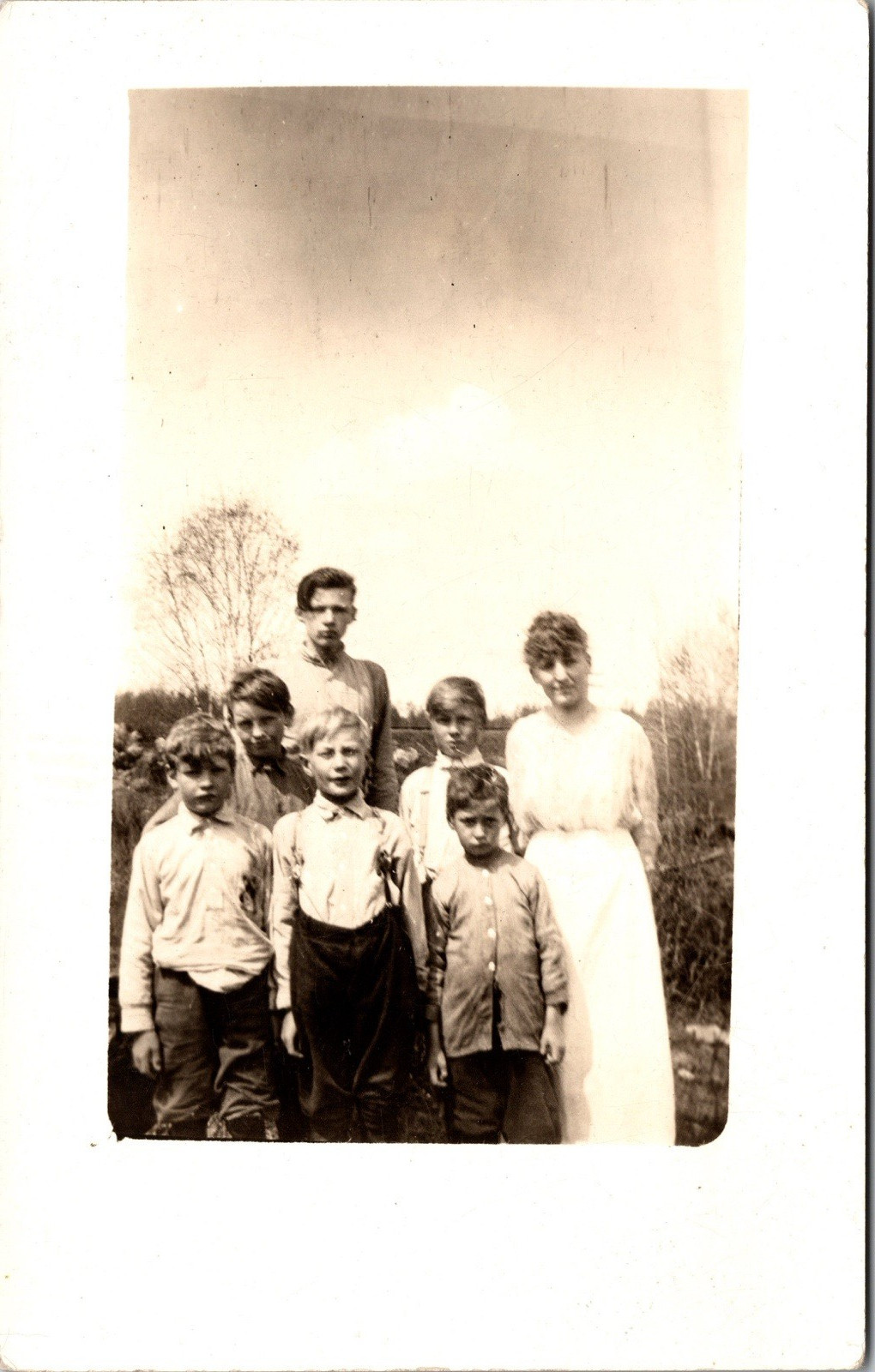 Postcard Real Photo RPPC Woman with a Group of Boys Outside