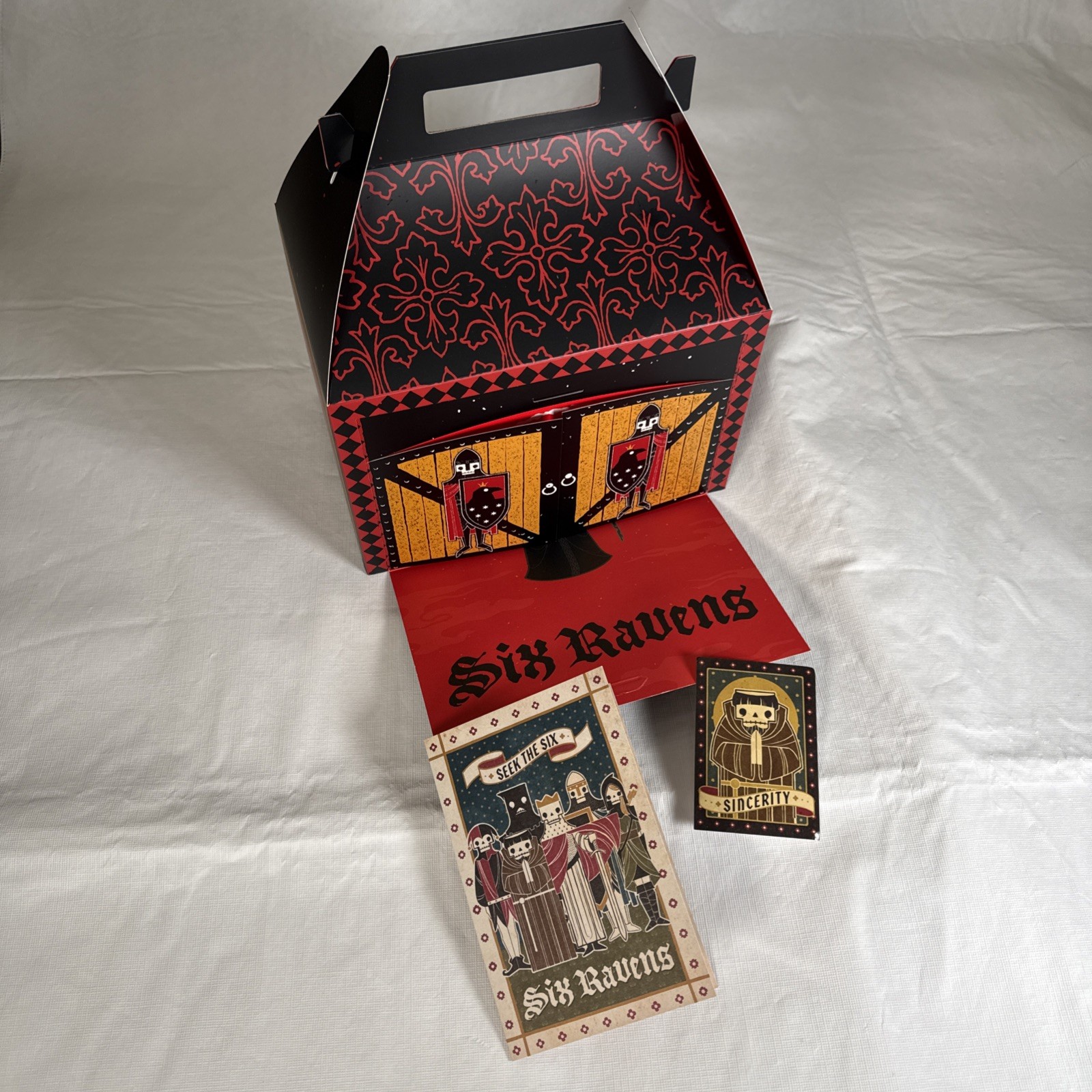 Gideon’s Bakehouse Six Ravens Seek The Six Food Menu, Box, & Sticker