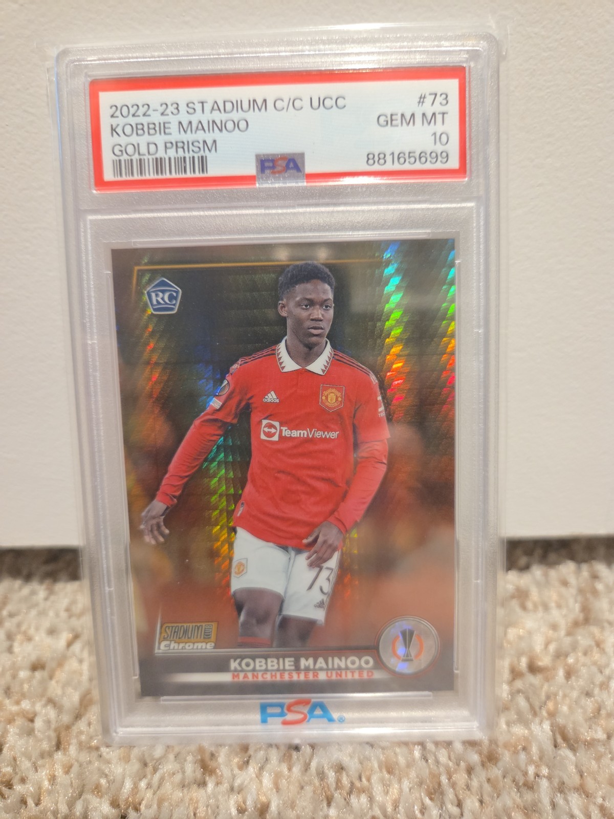 2022-23 Topps Stadium Club Chrome UCC Kobbie Mainoo Gold Prism /50 RC PSA 10