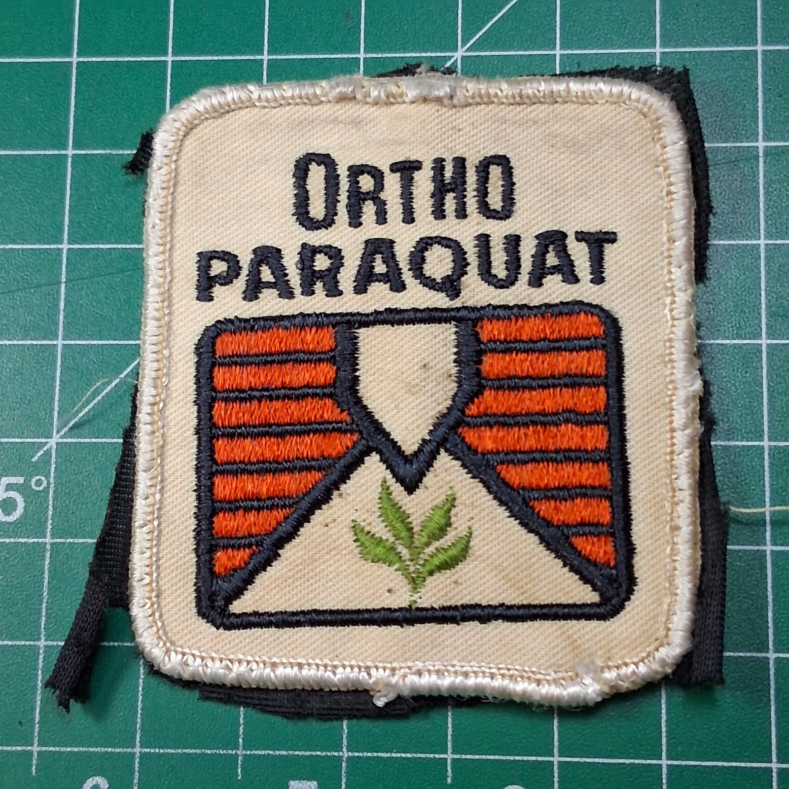 Vintage Ortho Paraquat Orange Embroidered Shield & Plant Design Patch Vintage Ortho Paraquat Orange Embroidered Shield & Plant Design Patch