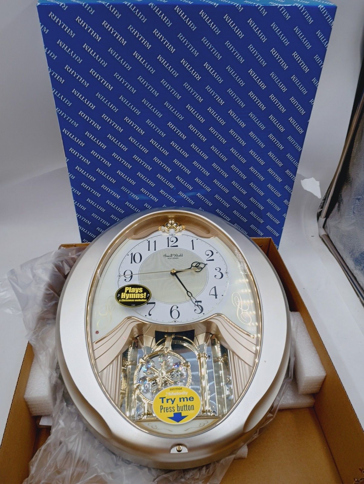 NEW RHYTHM 4MJ447WU18 CHAMPAGNE SNOWFLAKE MUSICAL MOTION WALL CLOCK 18 MELODIES