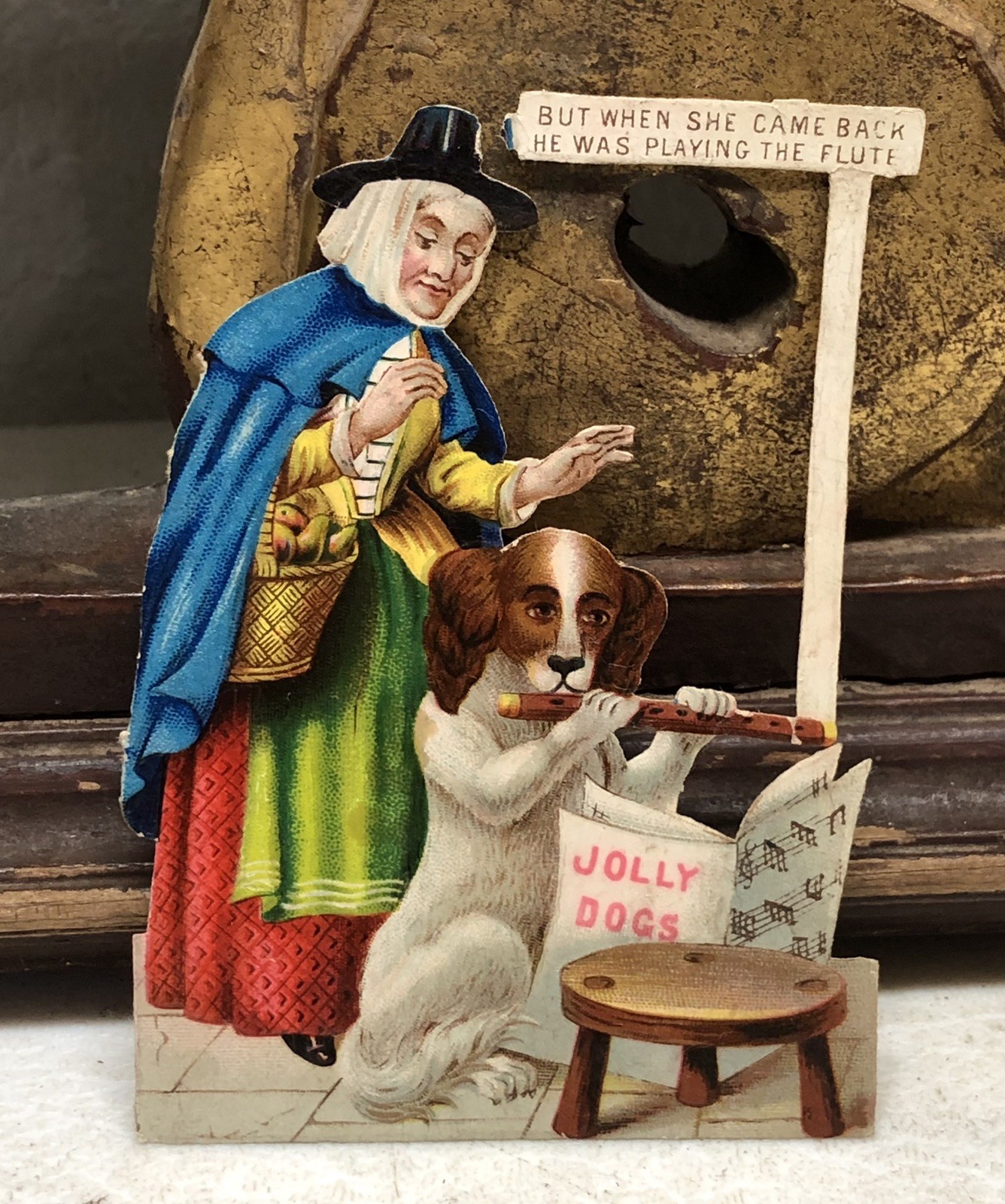 Victorian Die Cut Embossed Grandma w/ Dog playing Flute Victorian Die Cut Embossed Grandma w/ Dog playing Flute