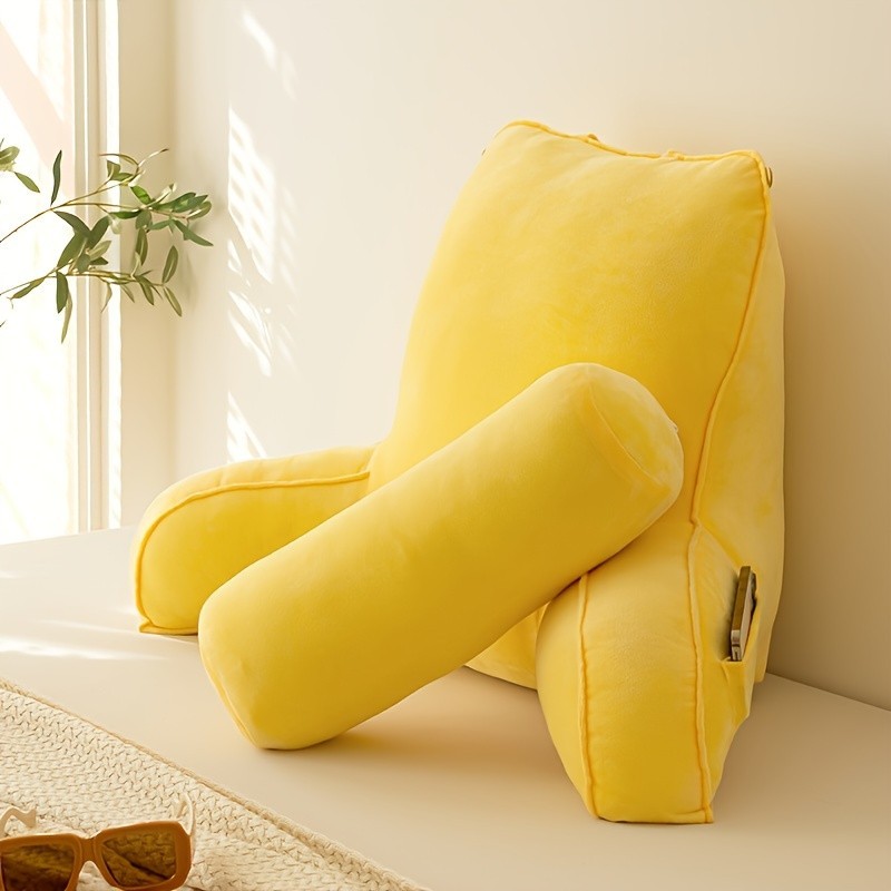 The reading pillow has a waist support, an armrest, and a neck support. The reading pillow has a waist support, an armrest, and a neck support.