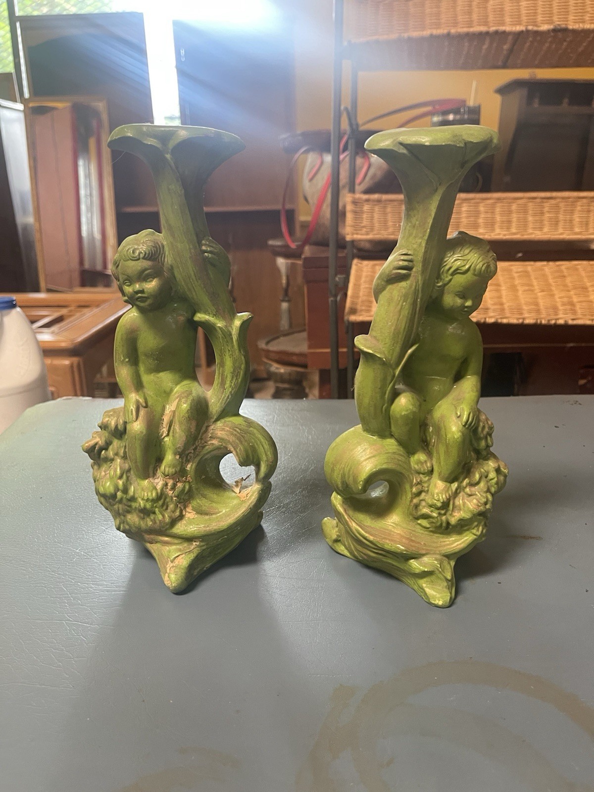 charming vintage pair of mid-century avocado green cherub candlestick holders.