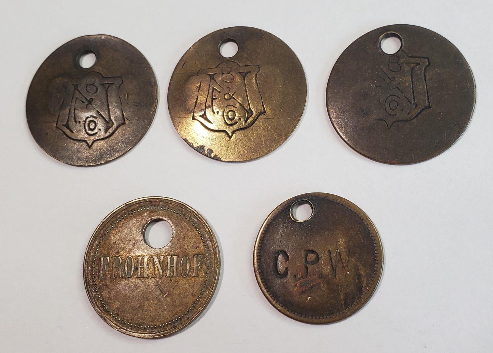 Lot of 5 Antique Brass Tool Check Tags -- NB&F Co (or B&FN Co), Frohnhof, & CPW Lot of 5 Antique Brass Tool Check Tags -- NB&F Co (or B&FN Co), Frohnhof, & CPW
