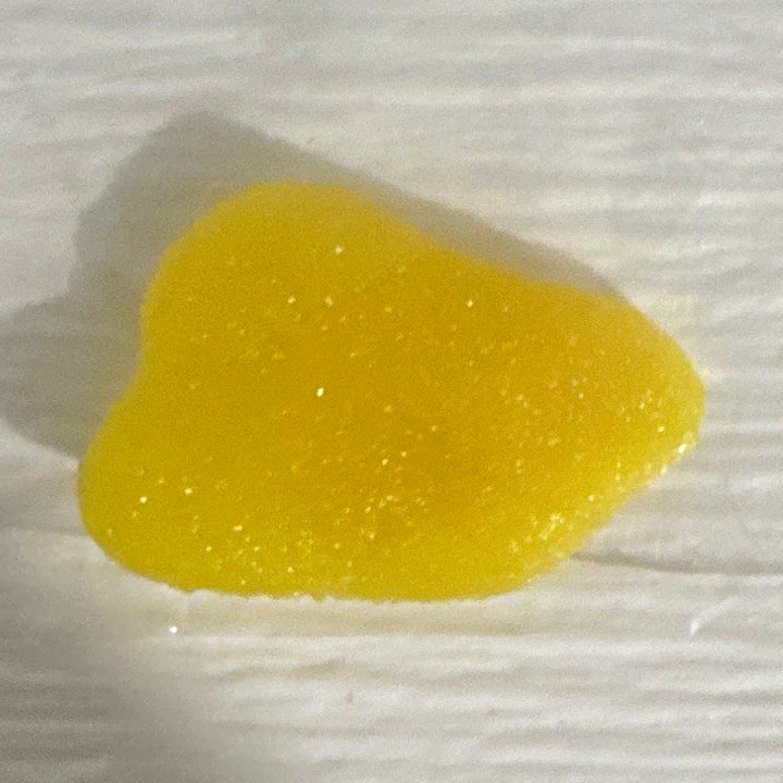 Shark tooth shaped sour patch kid