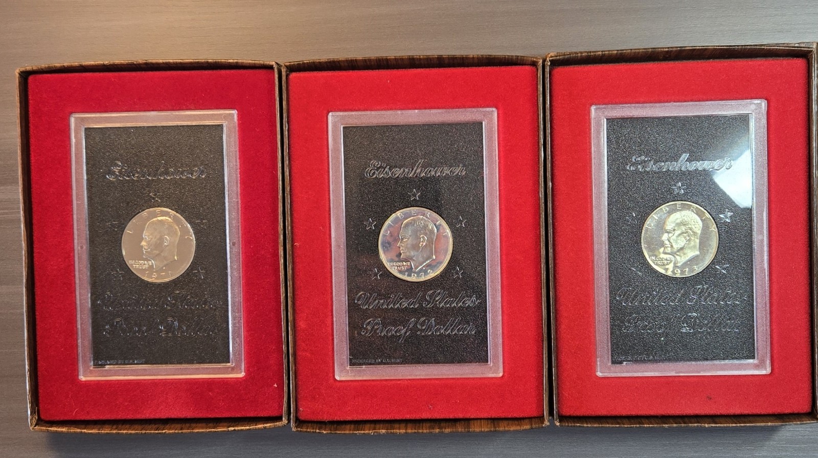 (3) 1971, 1972, 1973 S EISENHOWER PROOF SILVER DOLLAR WITH BROWN BOX’S #782 (3) 1971, 1972, 1973 S EISENHOWER PROOF SILVER DOLLAR WITH BROWN BOX’S #782