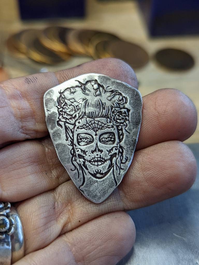 Sterling silver shield guitar pick from NicisPicks with day of the dead woman -
