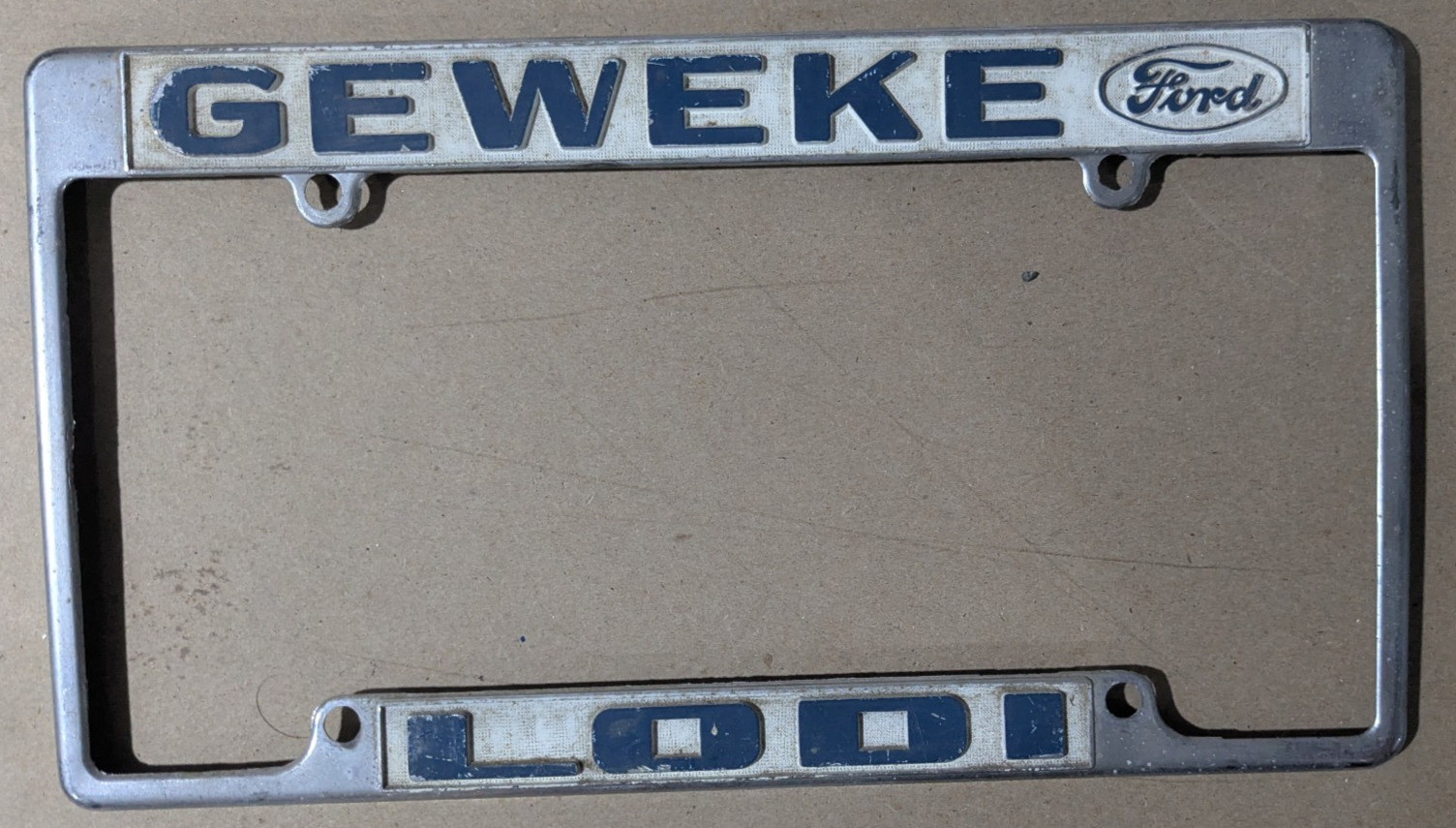 VTG Metal Geweke Lodi Embossed Ford Dealership License Plate Frame Gas & Oil
