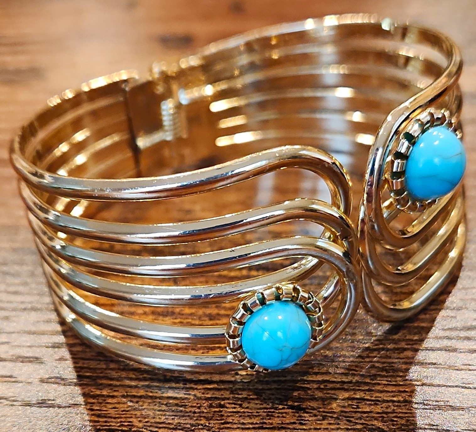 Gold Tone Metal Hinged Cuff Bracelet w/ 2 Blue Round Bezel Set Stones