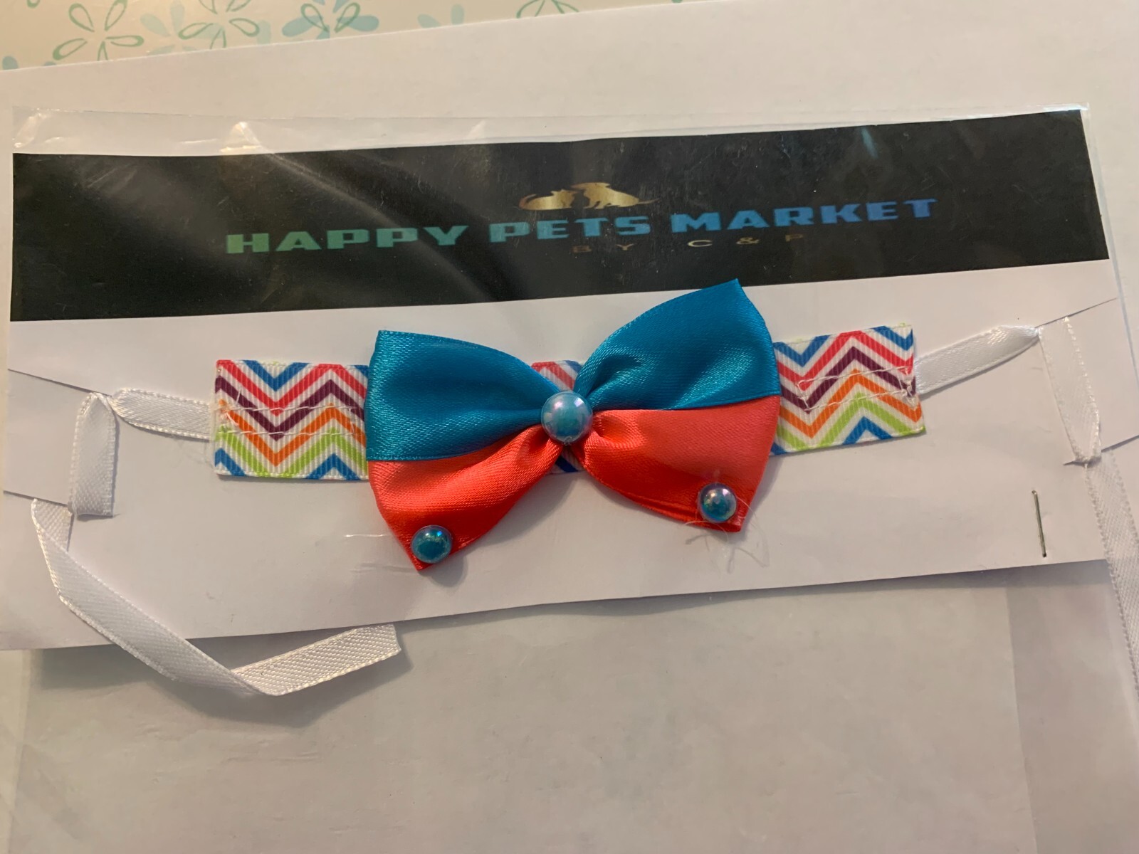 Pet accessory for a small dog with different colors and different designs.