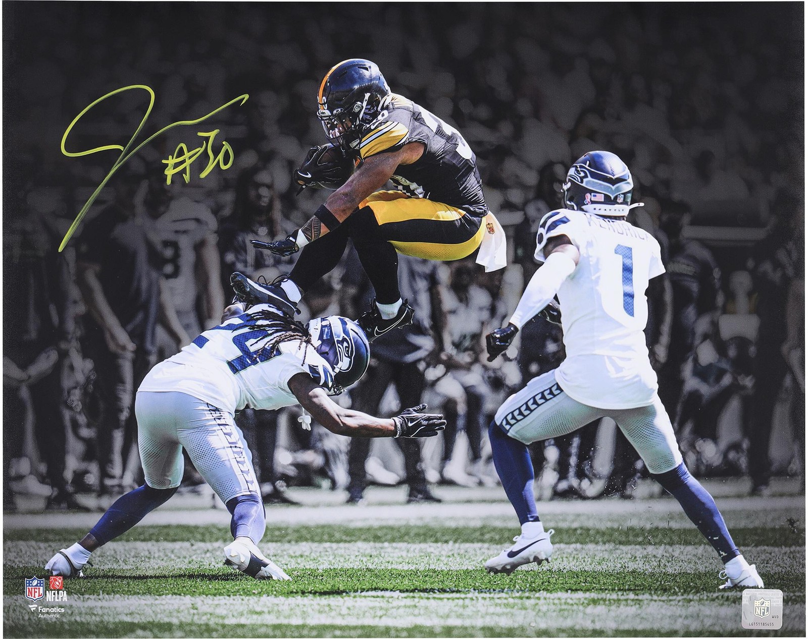 Jaylen Warren Steelers Autographed 16x20 Leaping over Defender Spotlight Photo