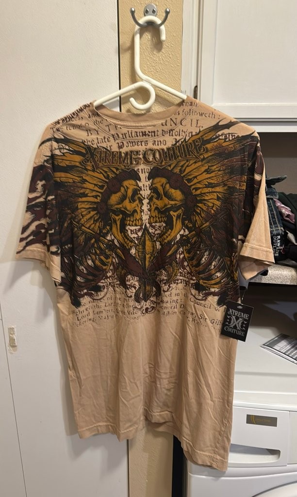 Xtreme Couture Graphic T-Shirt with Skull and Text Design