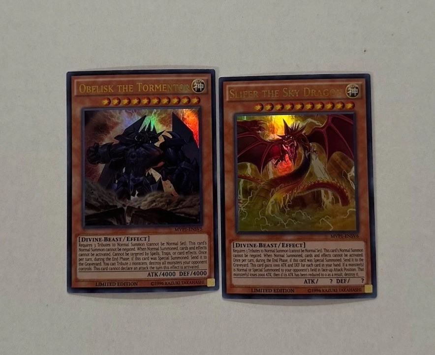 YUGIOH: Obelisk The Tormentor + Slifer The Sky Dragon MVP1-ENSV5 MVP1-ENSV6 NM YUGIOH: Obelisk The Tormentor + Slifer The Sky Dragon MVP1-ENSV5 MVP1-ENSV6 NM