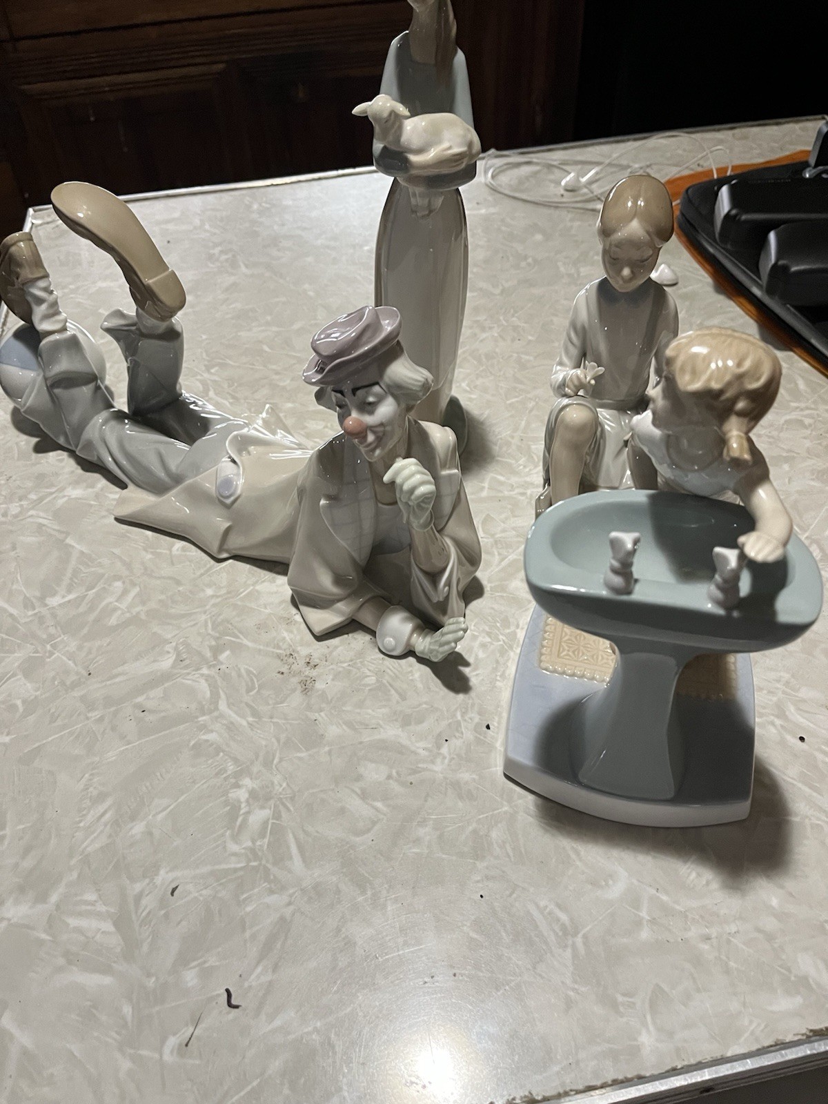 lladro figurines four in total sold together at a great price pick up only