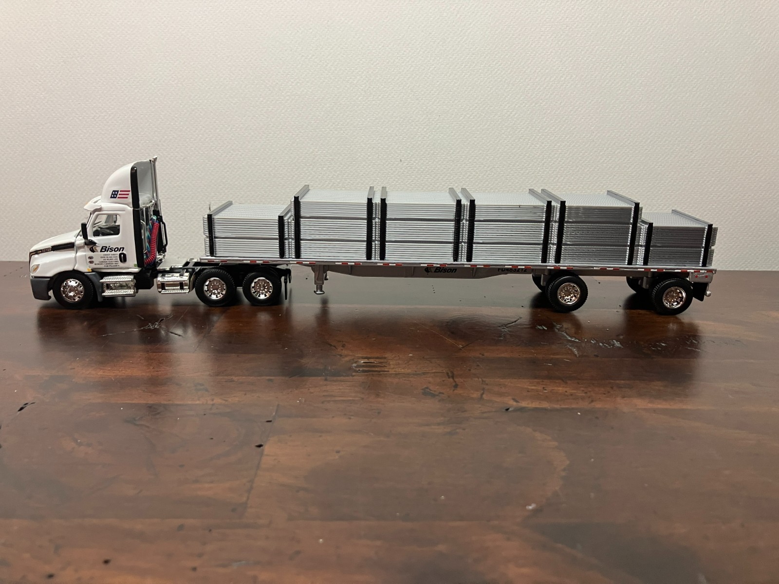 DCP First Gear 1/64th Bison Transport Cascadia Day Cab and 48\' Flatbed with Load DCP First Gear 1/64th Bison Transport Cascadia Day Cab and 48\' Flatbed with Load
