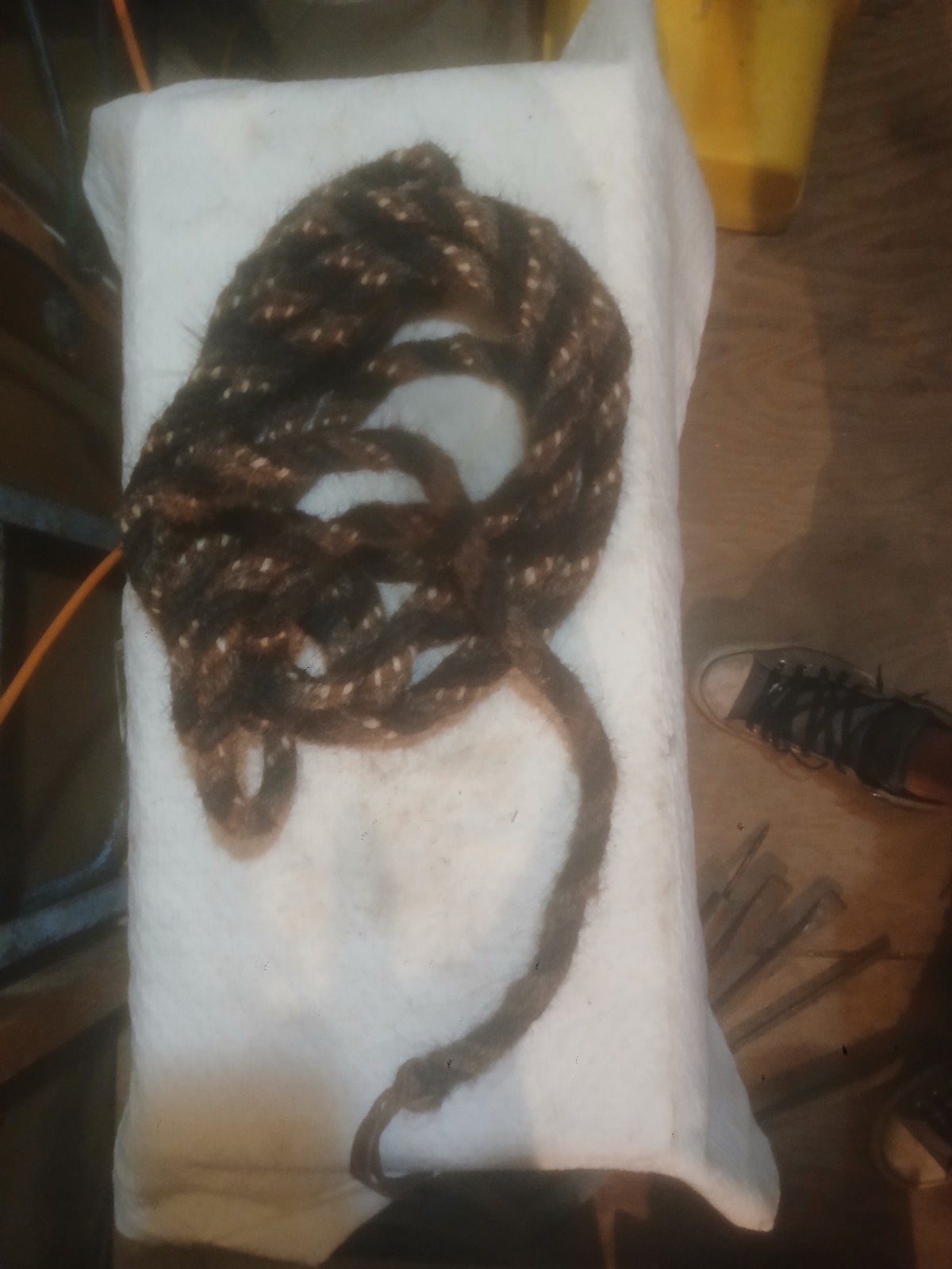 The item shown is a traditional hand-twisted or braided horsehair mecate rein The item shown is a traditional hand-twisted or braided horsehair mecate rein