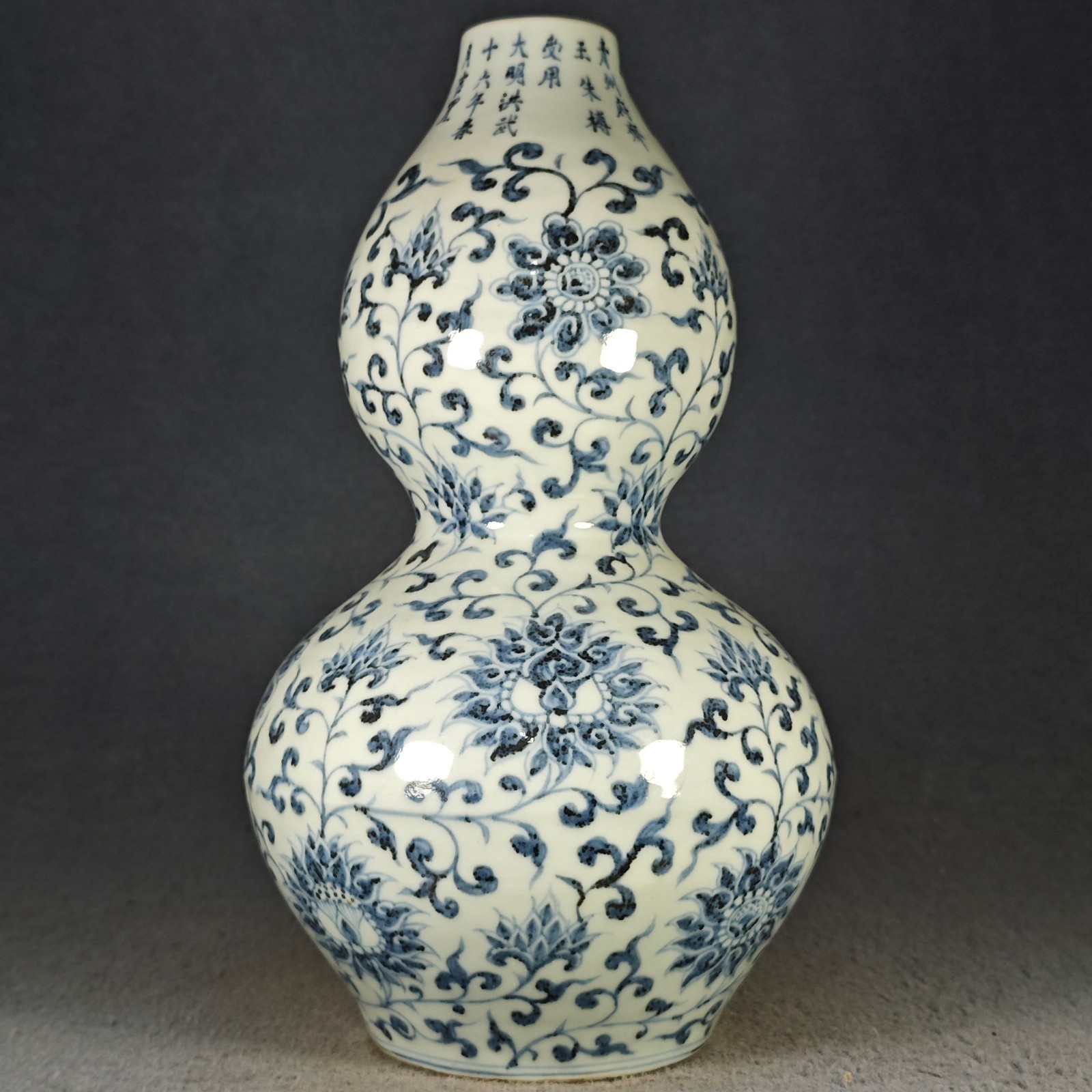Antique Chinese Ming Dynasty blue-and-white gourd-shaped vase with scrolling lot