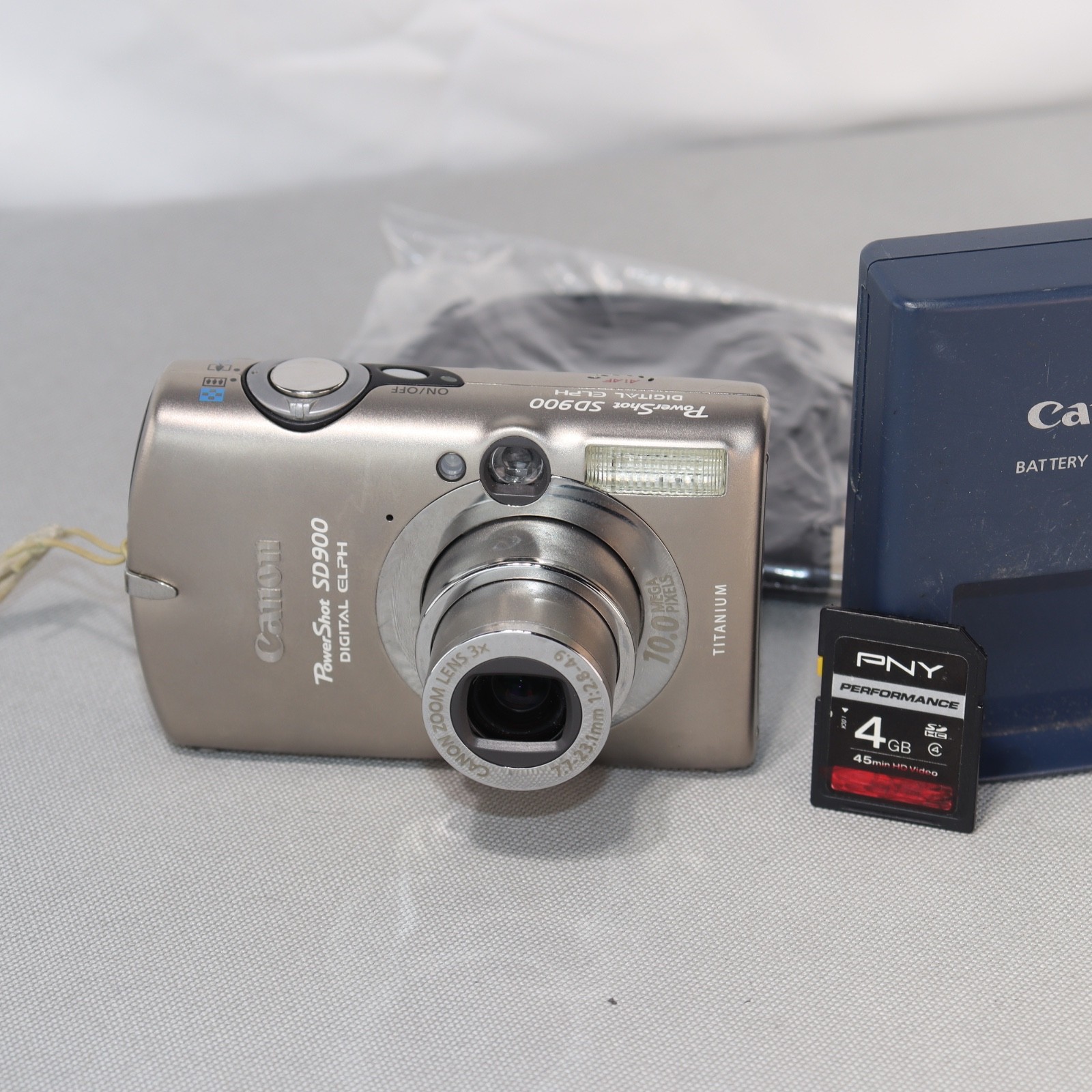 Canon PowerShot Digital ELPH SD900 Titanium Camera *TESTED* W Charger + 4gb SD Canon PowerShot Digital ELPH SD900 Titanium Camera *TESTED* W Charger + 4gb SD