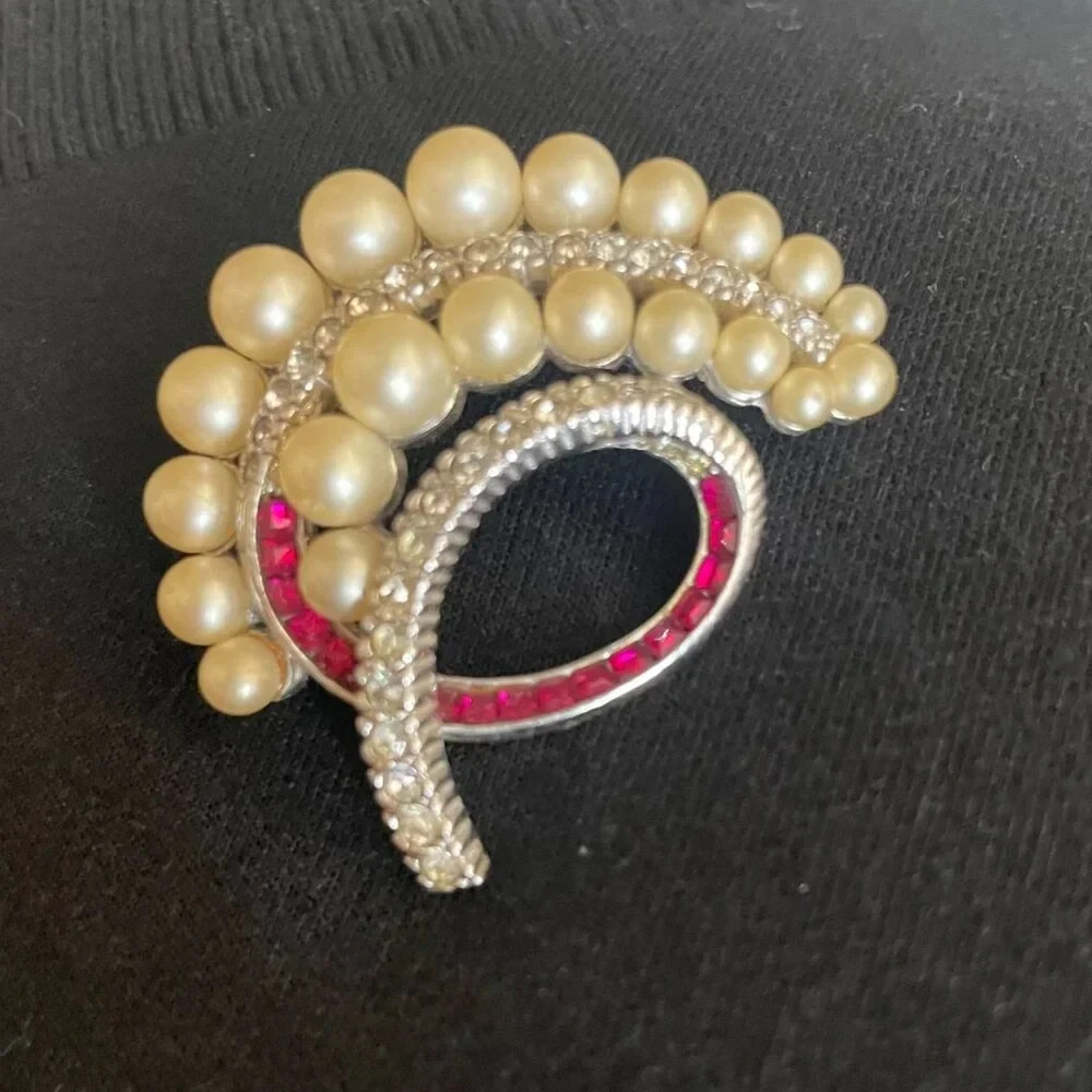 Vintage signed Ciner brooch with pearls, clear and channel-set red crystals