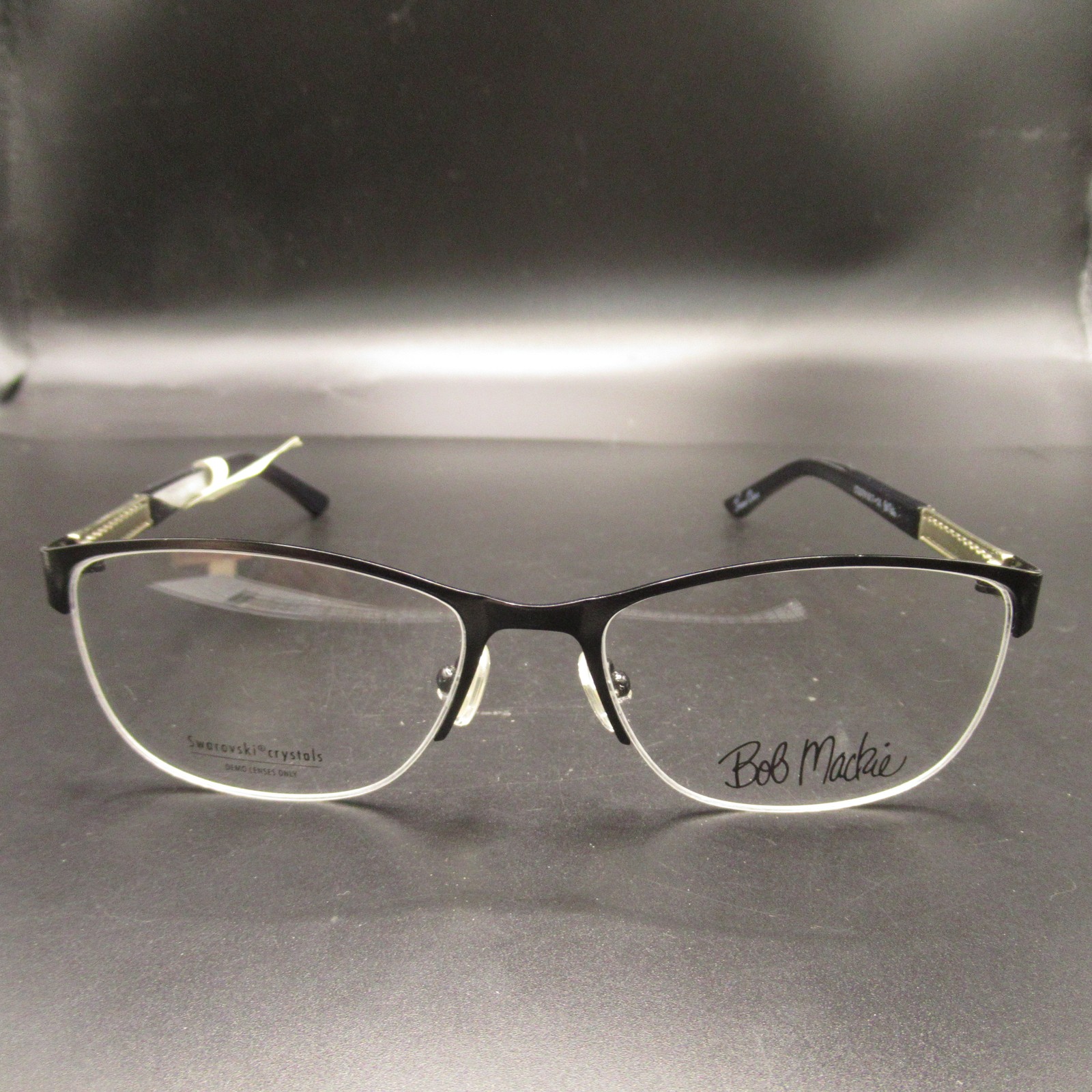 Bob Mackie Eyeglass Frames BOBB115FS530BLK 53-17-135 Black Half-Rim Swarovski Bob Mackie Eyeglass Frames BOBB115FS530BLK 53-17-135 Black Half-Rim Swarovski