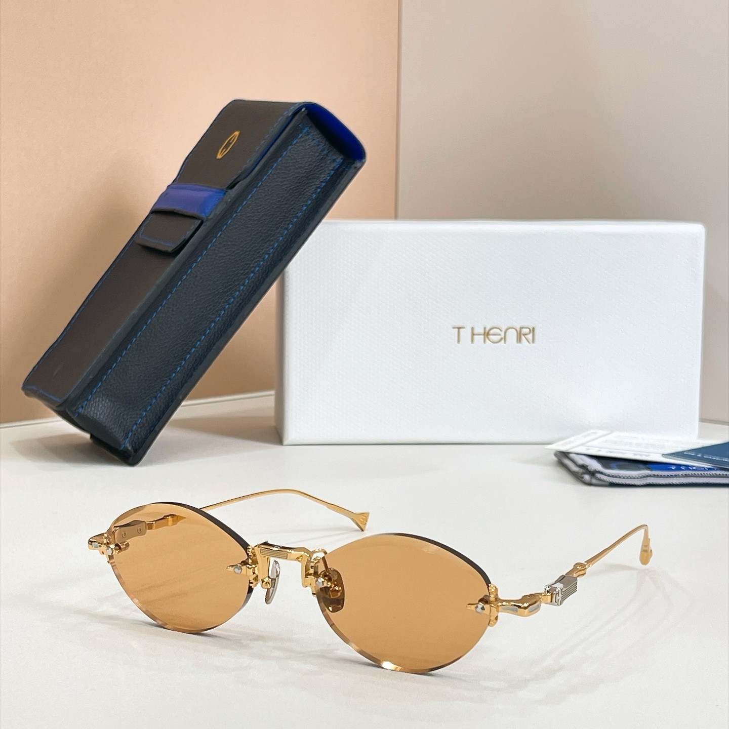 T-HENRI MOONBEAM Rimless Oval Sunglasses Gold Frame Amber Lenses 53-21-146 T-HENRI MOONBEAM Rimless Oval Sunglasses Gold Frame Amber Lenses 53-21-146