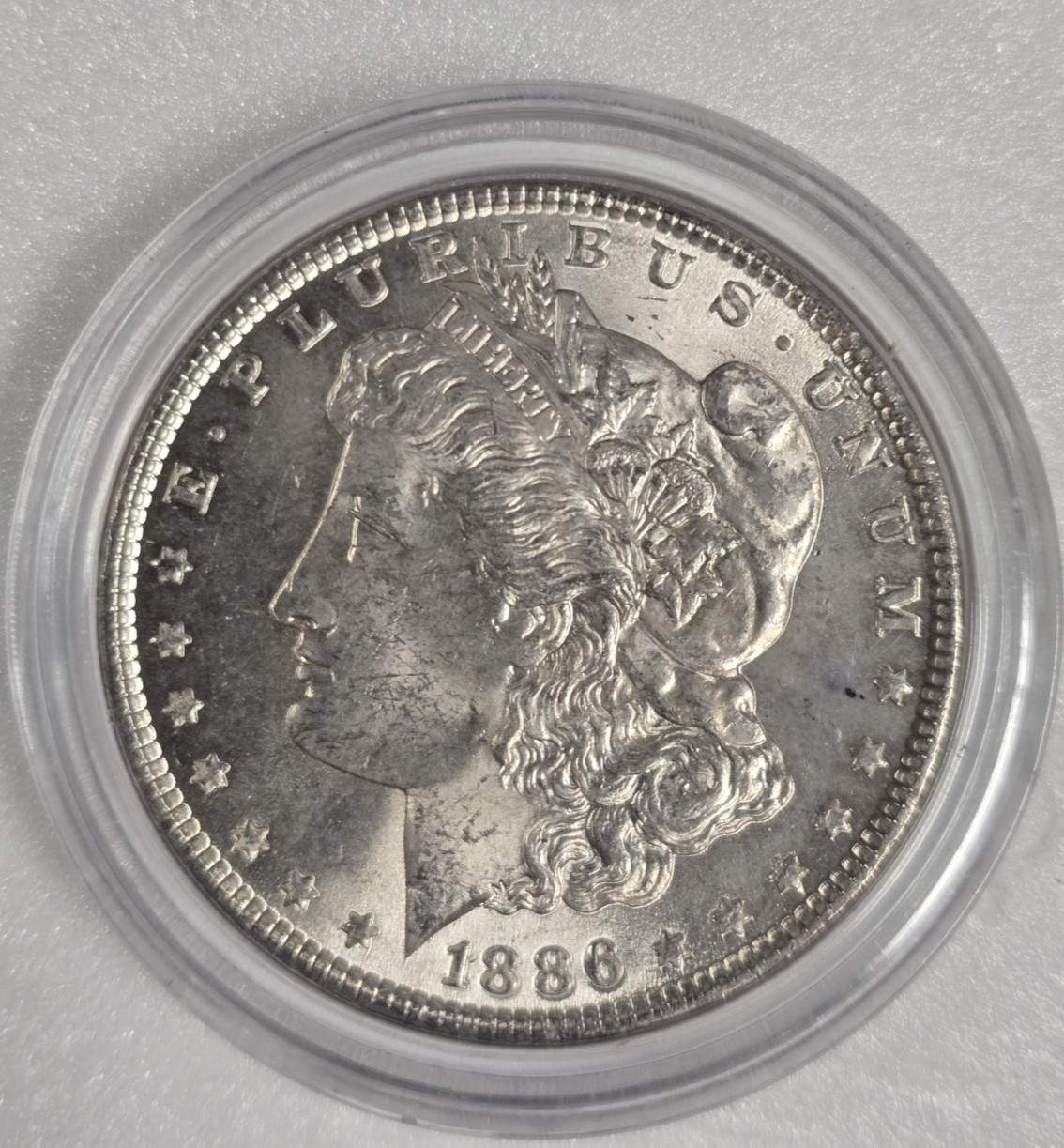 11086AUE MORGAN SILVER DOLLAR $1 YEAR 1886 PHILADELPHIA CAP AU DETAIL COIN 90%AG