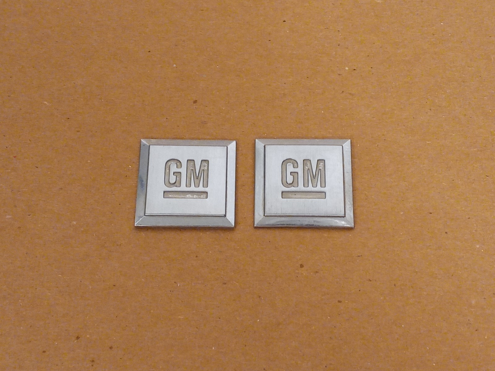 (2) Big GM Mark of Excellence Square Fender Emblems Rear Deck Lid Badge OEM USED (2) Big GM Mark of Excellence Square Fender Emblems Rear Deck Lid Badge OEM USED