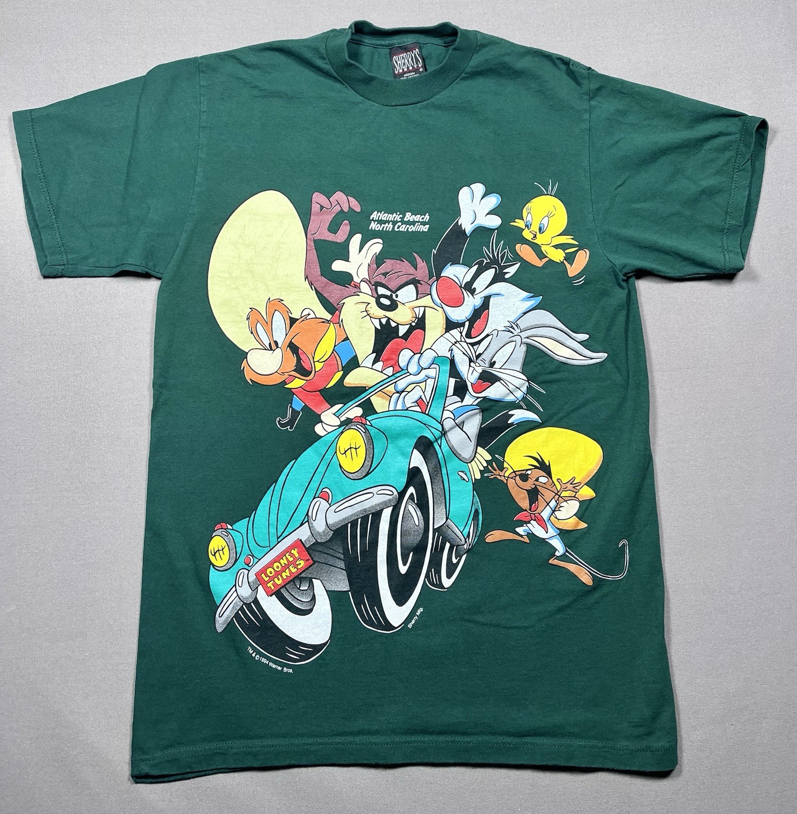 Vintage 1994 Looney Tunes Sherry\'s Best Label Green T-Shirt - Size Medium Vintage 1994 Looney Tunes Sherry\'s Best Label Green T-Shirt - Size Medium