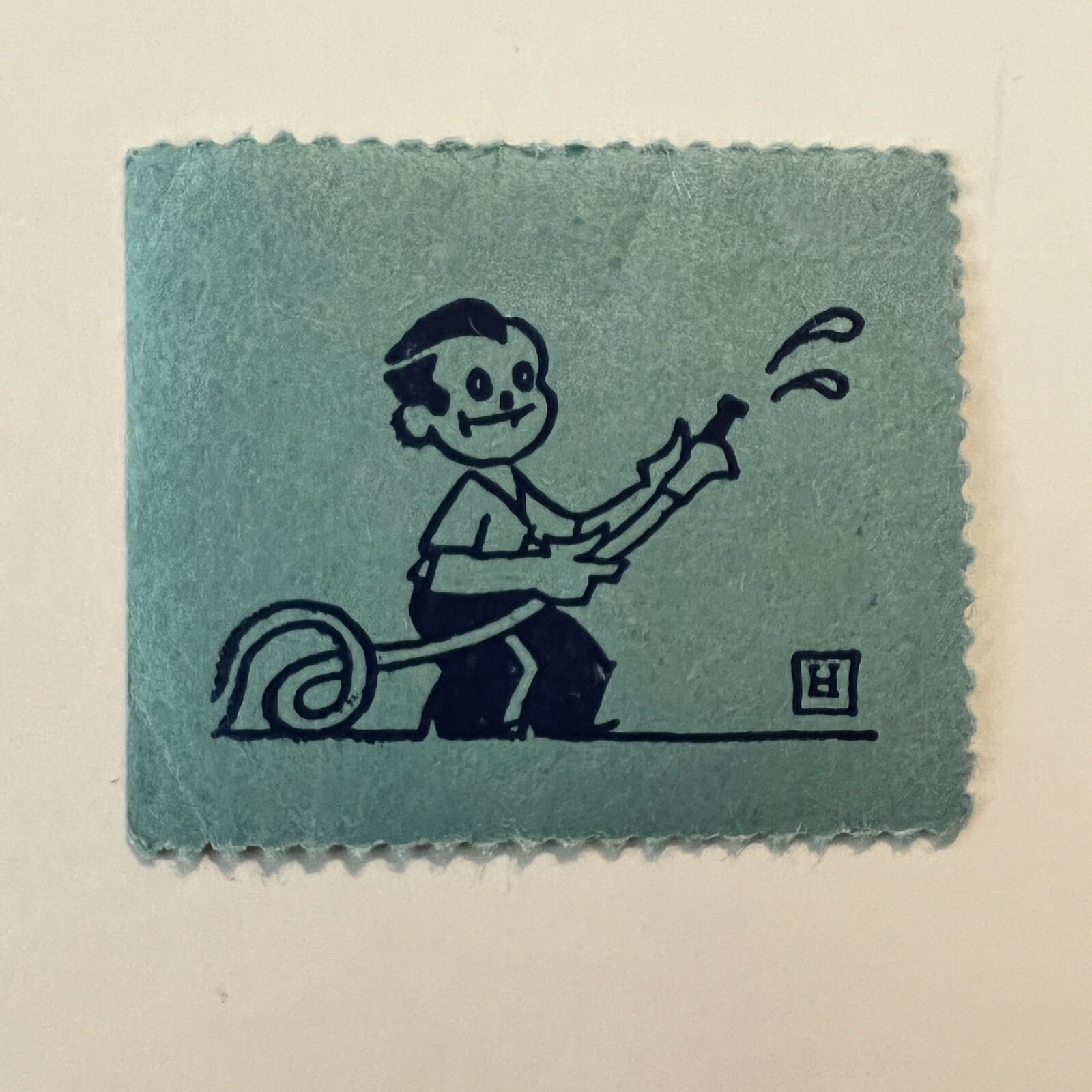 INTERESTING EARLY BOY WITH WATER HOSE CINDERELLA STAMP SEAL