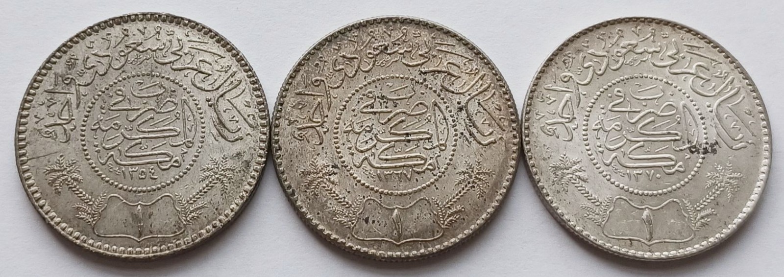 3 Saudi Arabia 1 Riyal Coins AU+, AH 1354 (1935), AH 1367 (1948), 1370 AH (1951) 3 Saudi Arabia 1 Riyal Coins AU+, AH 1354 (1935), AH 1367 (1948), 1370 AH (1951)