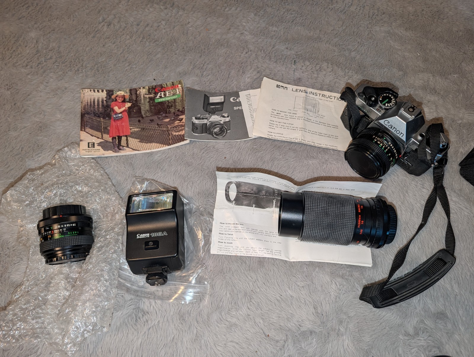Canon AE-1 Program 35mm Film Camera Lot Lenses Speedlite 188A Manuals Vintage