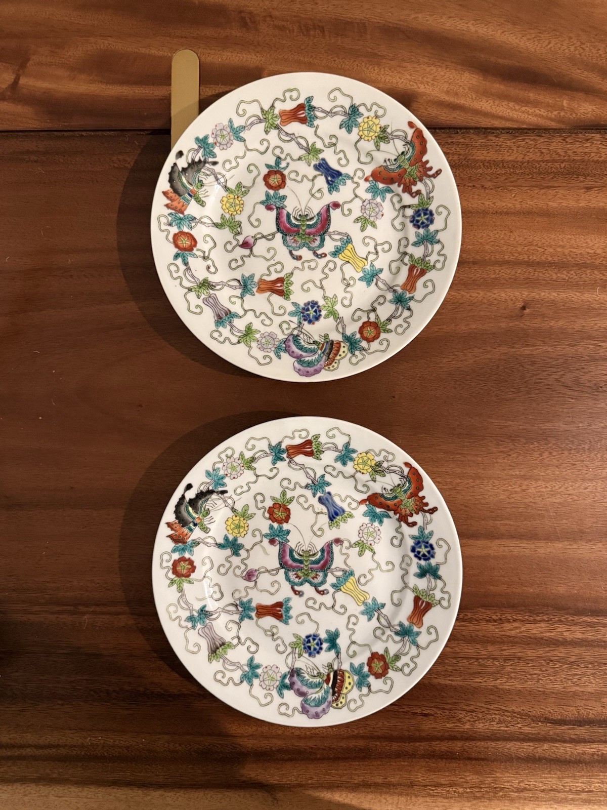 Pair of 8” hand painted butterfly plates